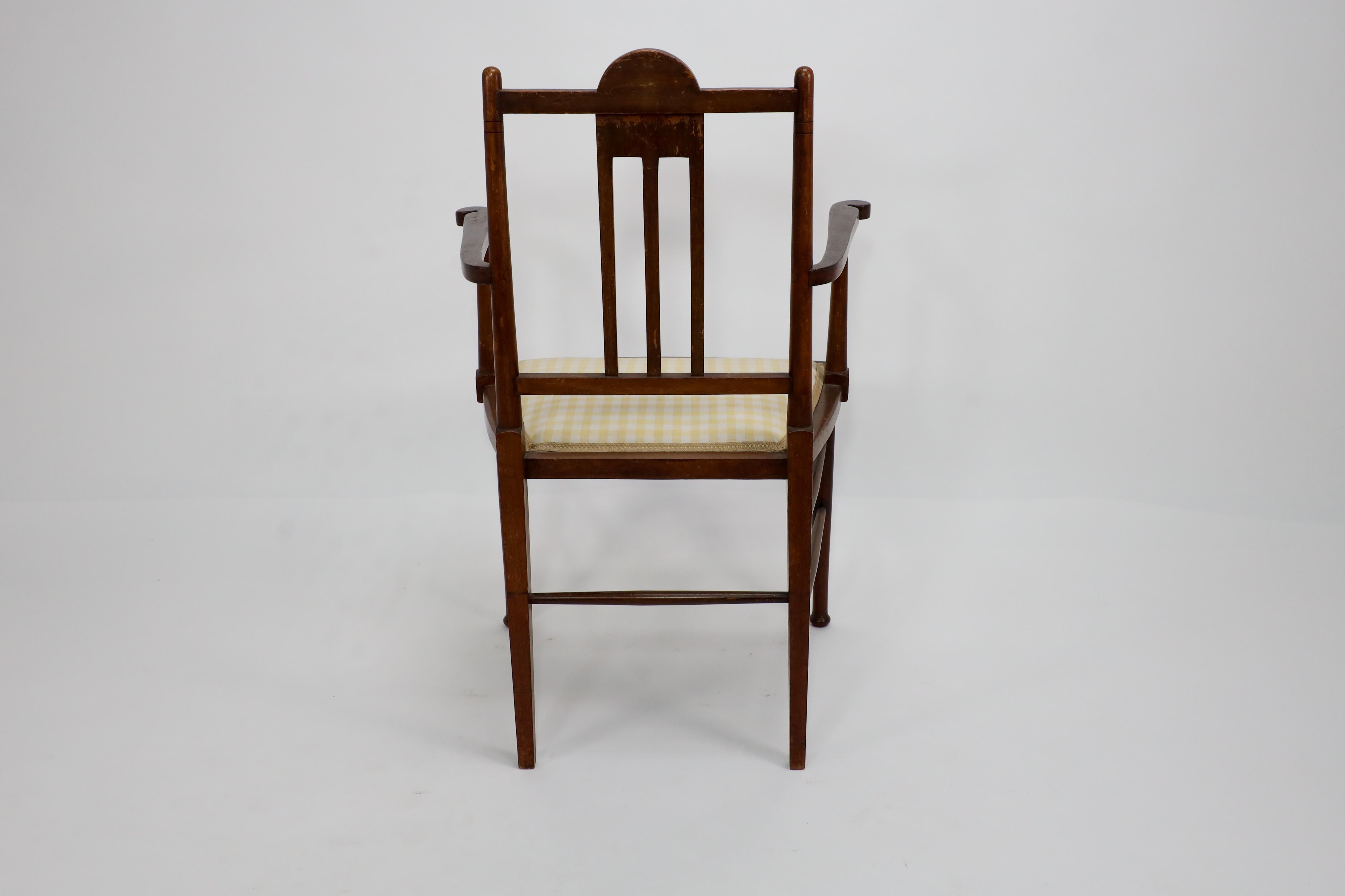Liberty and Co in the style of G M Ellwood. An Arts and Crafts Walnut armchair In Good Condition For Sale In London, GB
