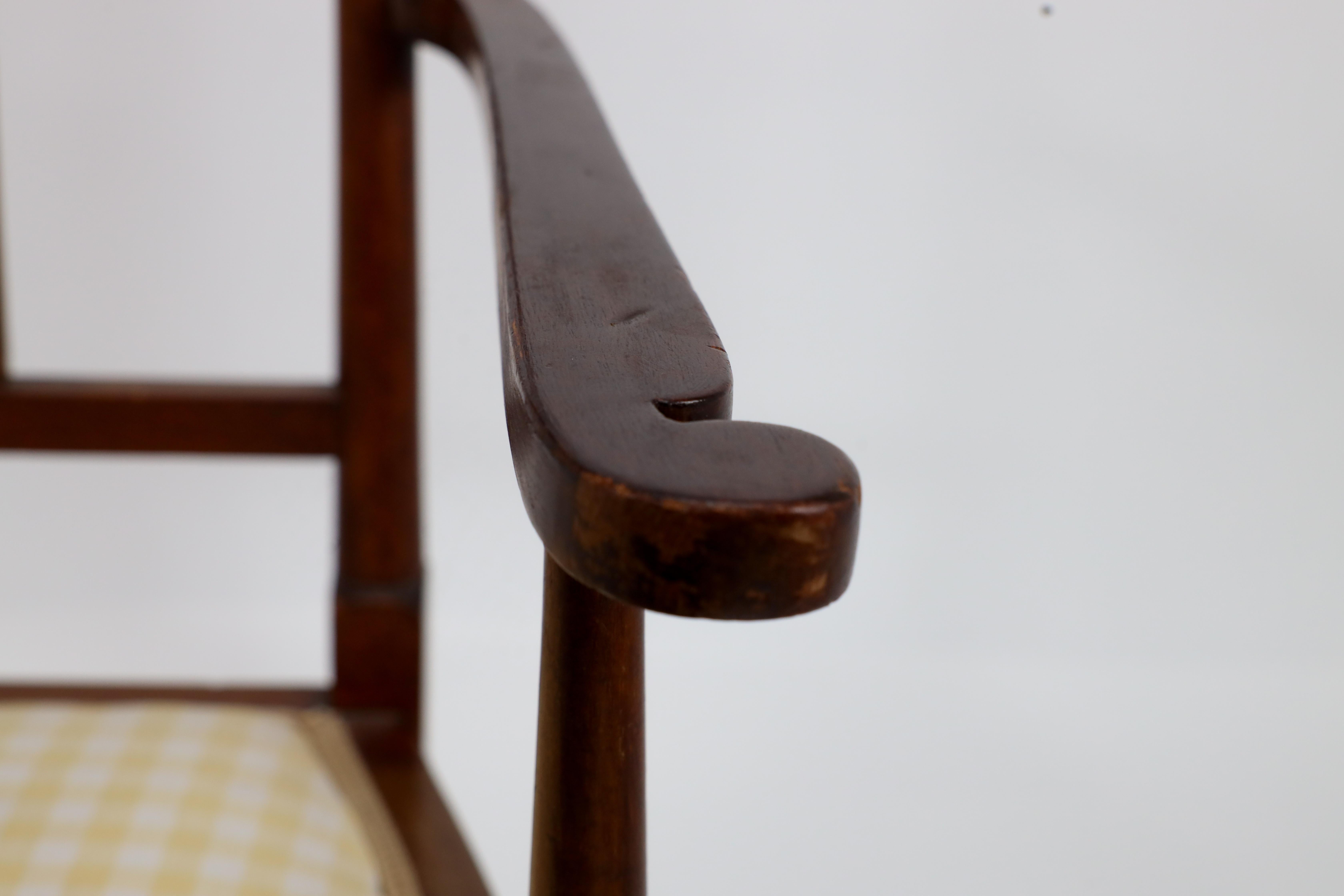 Liberty and Co in the style of G M Ellwood. An Arts and Crafts Walnut armchair For Sale 7
