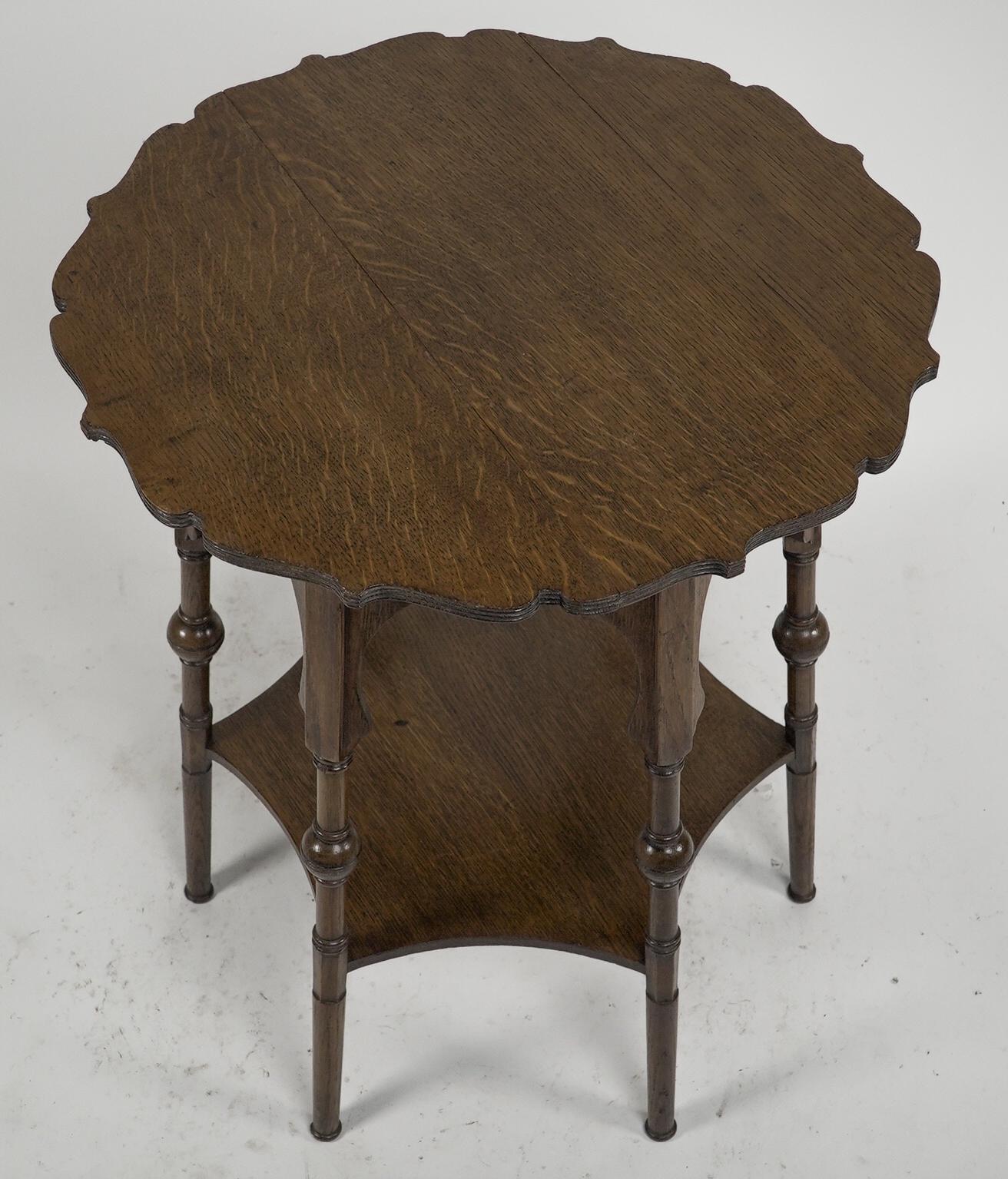 Arts and Crafts Liberty and Co. Oak side or occasional table with a shaped top and molded edges