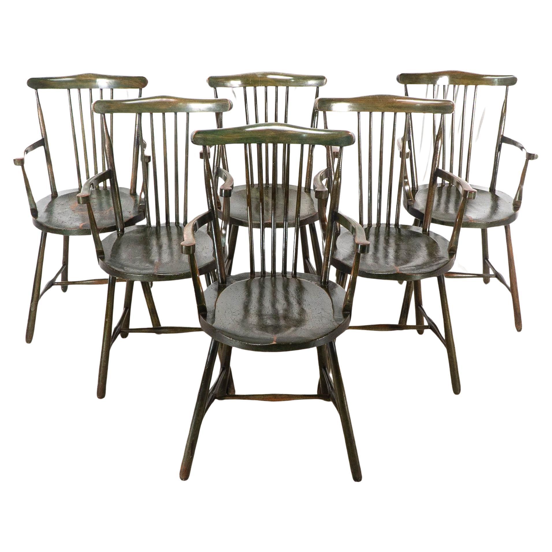Liberty and Co. Set of six Arts and Crafts walnut Windsor armchairs