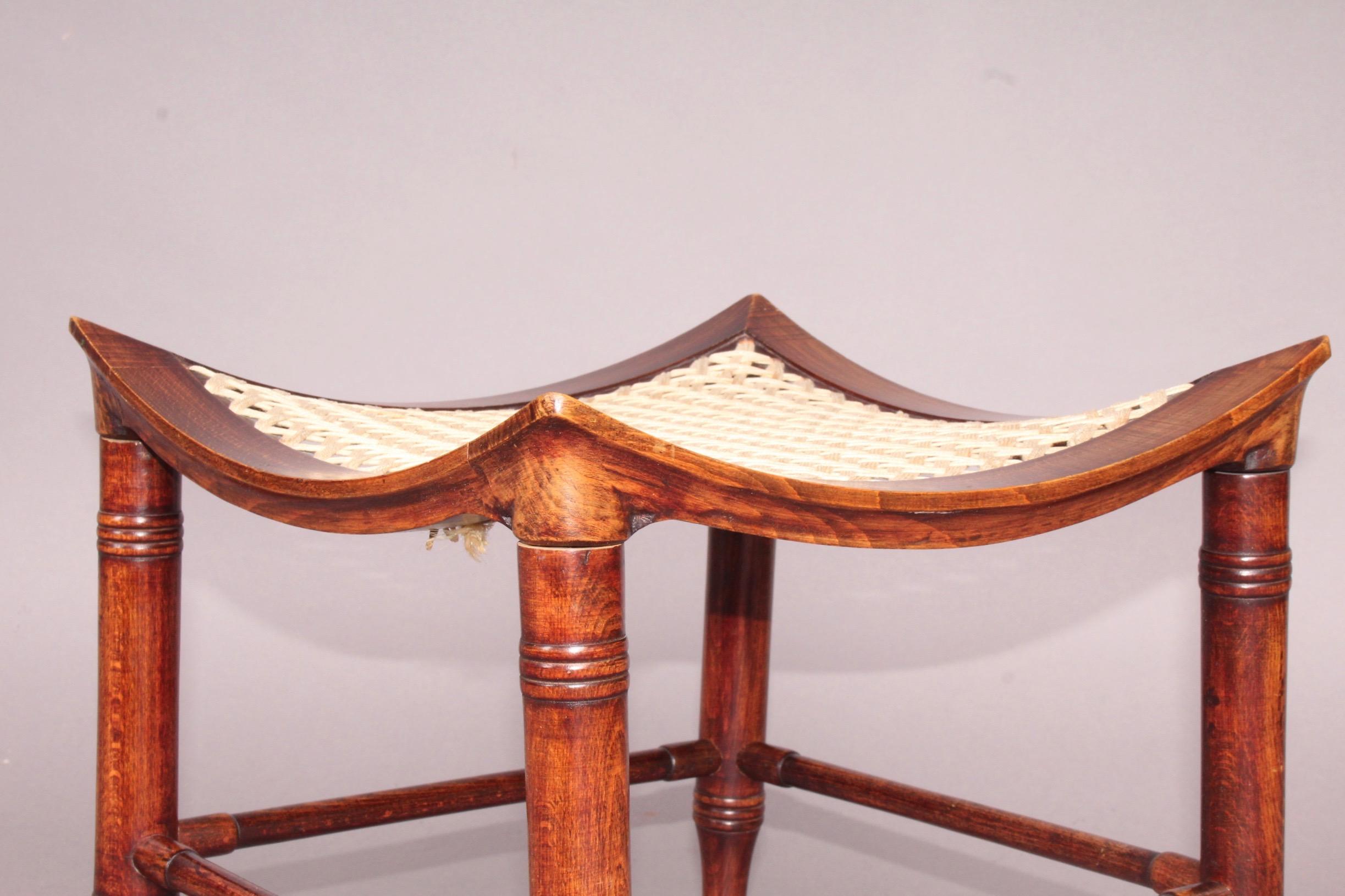 19th Century Liberty & Co. Stained Beech Dish Shaped Thebes Stool with Ring Turned Legs