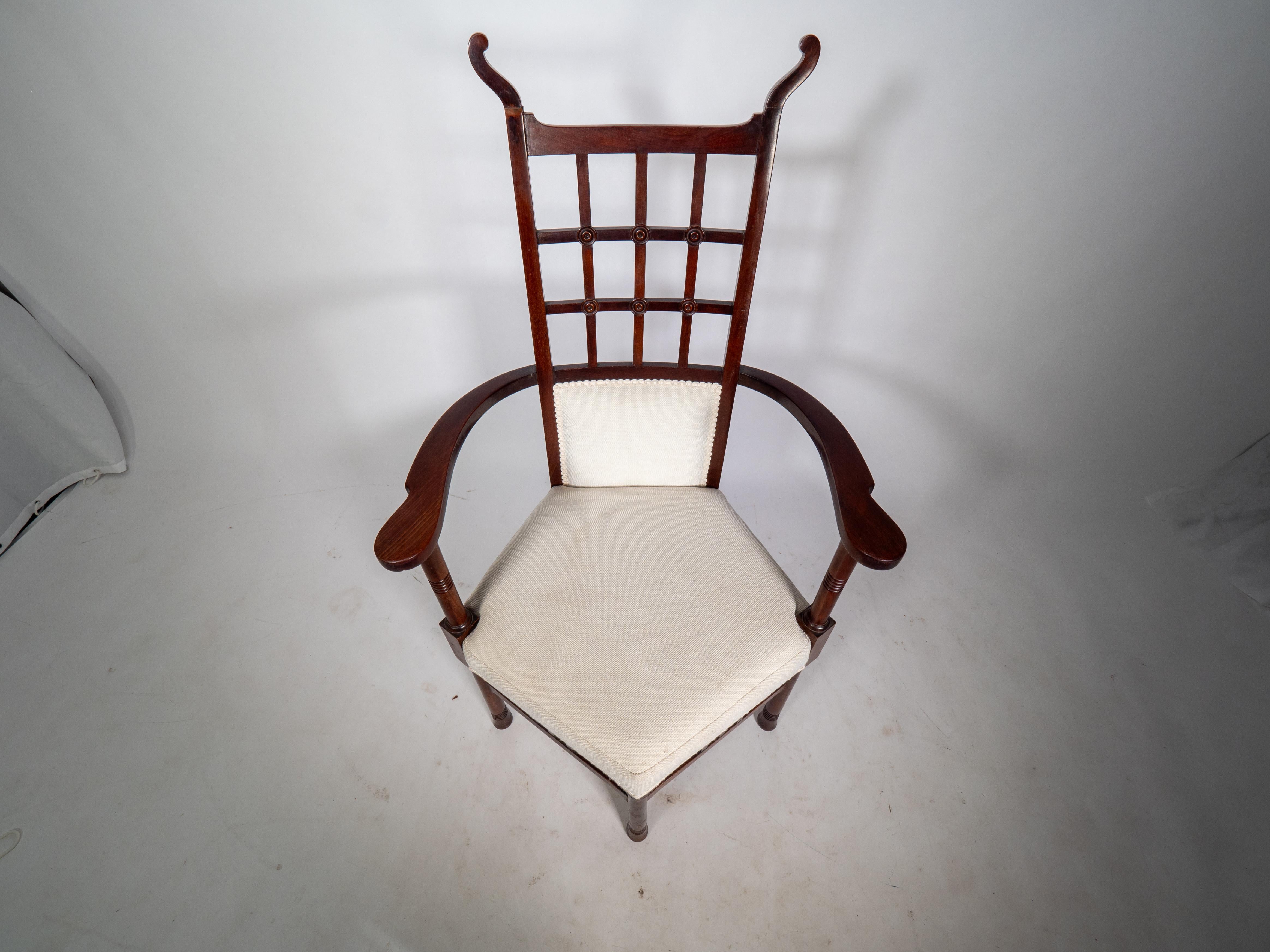 Liberty & Co probably made by William Birch. An Arts & Crafts mahogany armchair. For Sale 1
