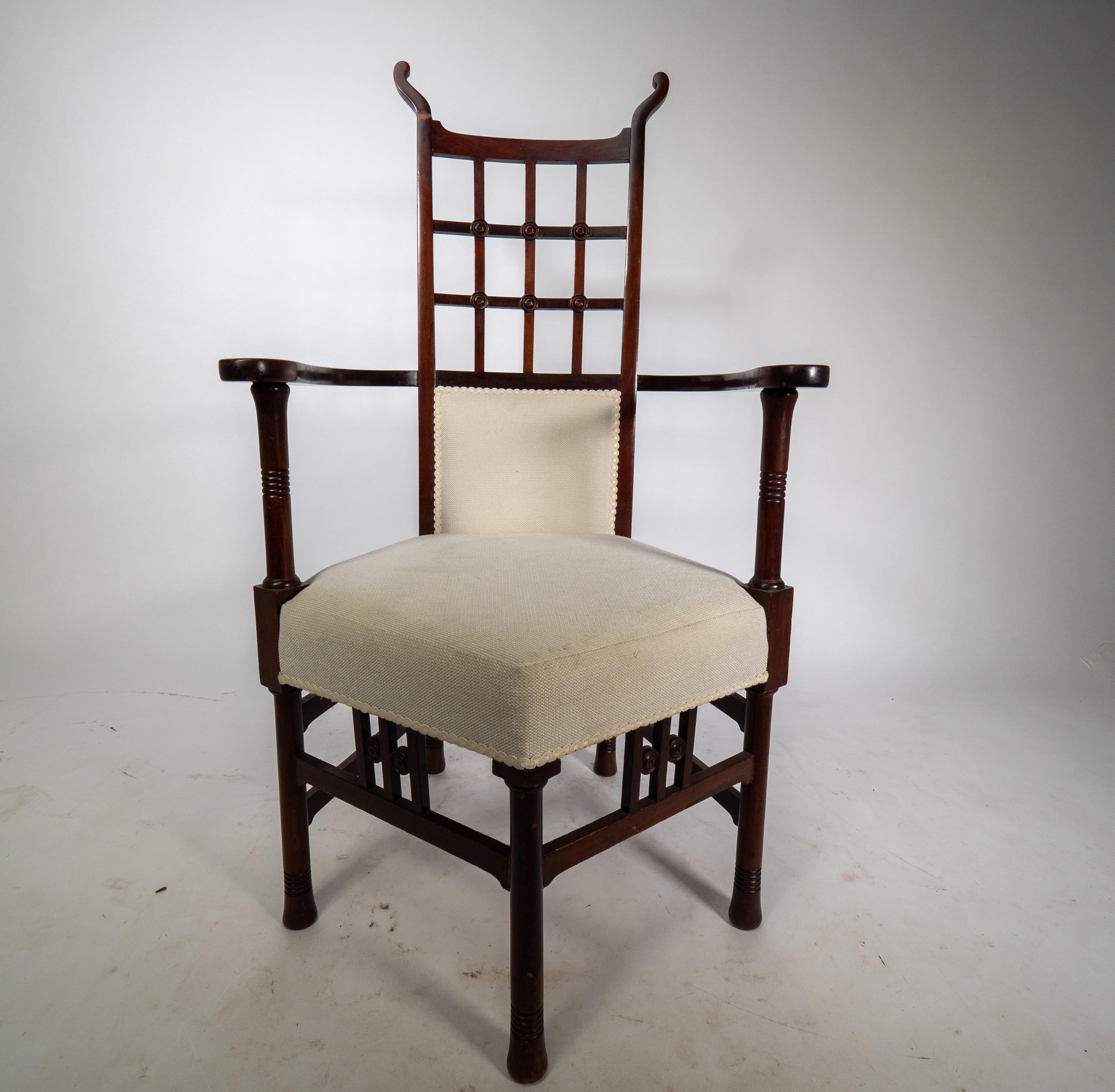 Arts and Crafts Liberty & Co probably made by William Birch. An Arts & Crafts mahogany armchair. For Sale