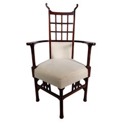 Liberty and Co (style of) probably made by William Birch. An mahogany armchair