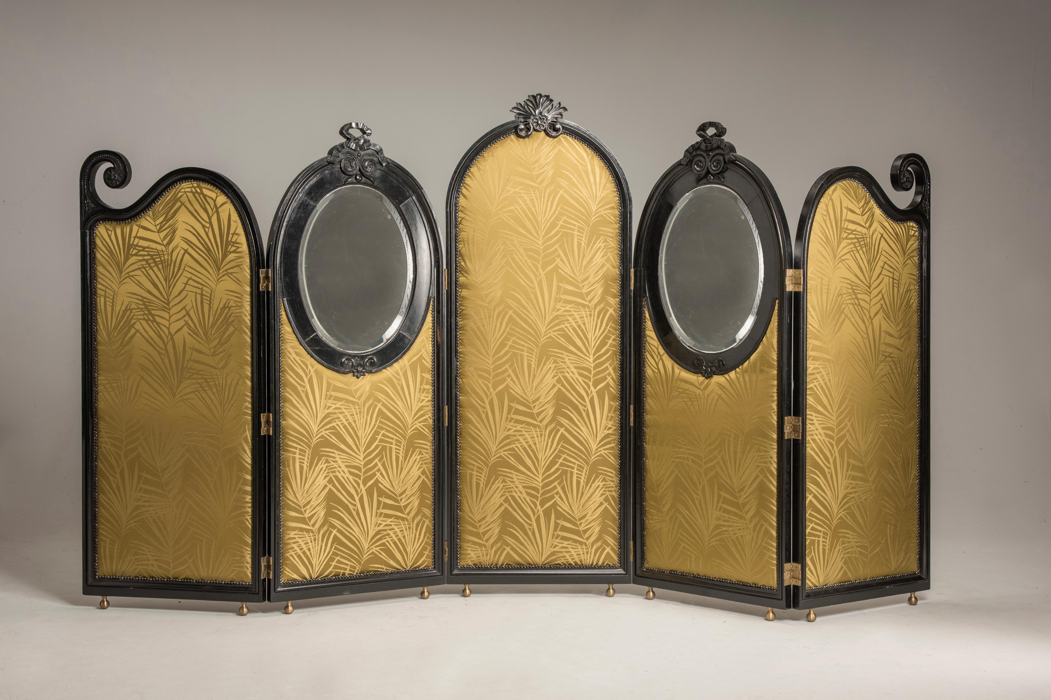 Art Nouveau liberty black wood green palm fabric five panels and oval mirrors room divider

An Art Nouveau screen composed by five folding panels, two of them carry two oval mirrors with beveled original glass. Ovals are on the front part, while