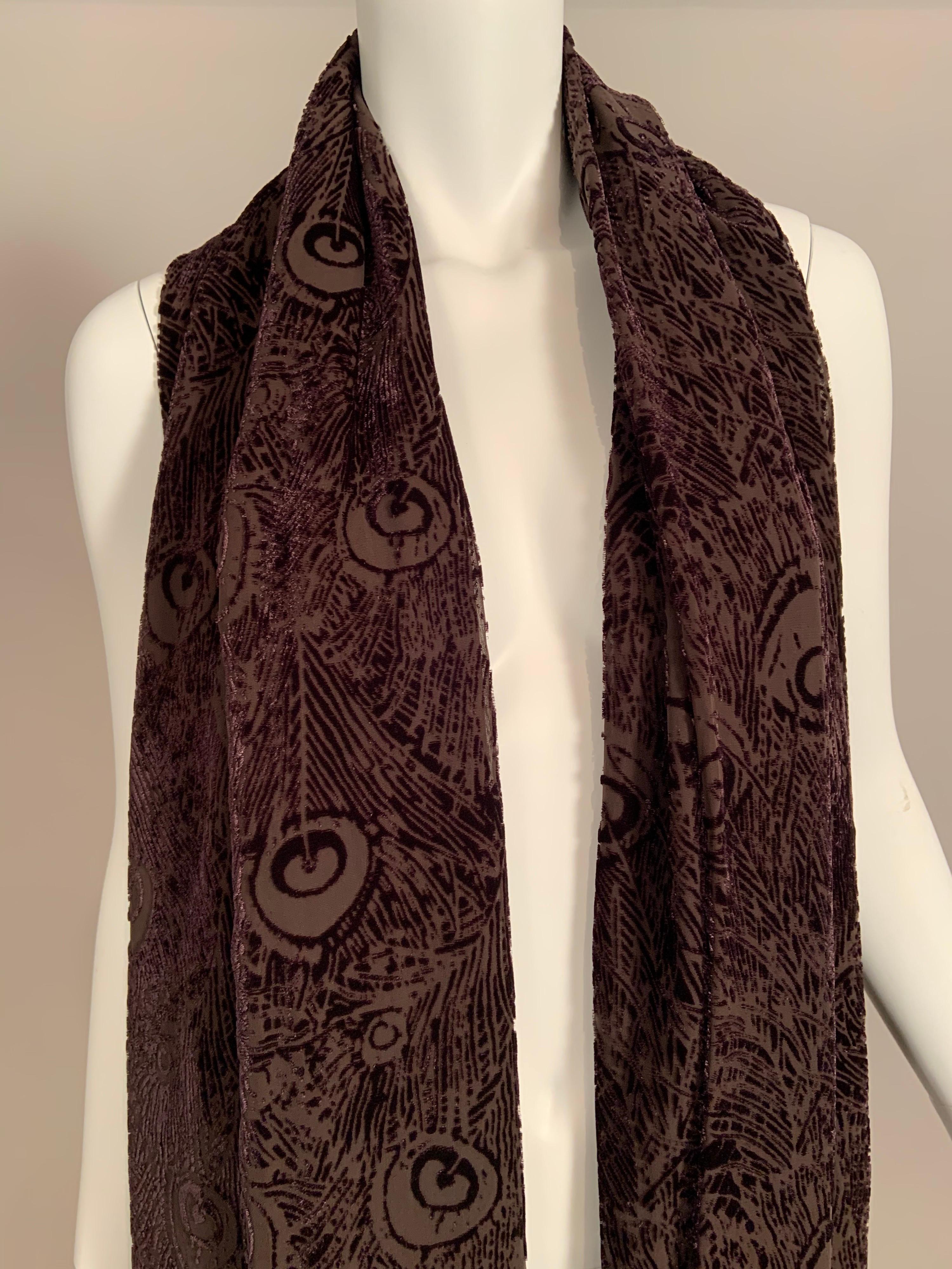 A charming Liberty of London shawl has a Peacock feather motif worked in chocolate brown voided velvet.
The shawl has black and brown fringe on the ends and it is in excellent condition.
Measurements:   Length 68