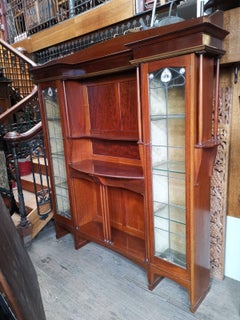 Liberty & Co. a Mahogany Display Cabinet with Floral Mother of Pearl Decoration