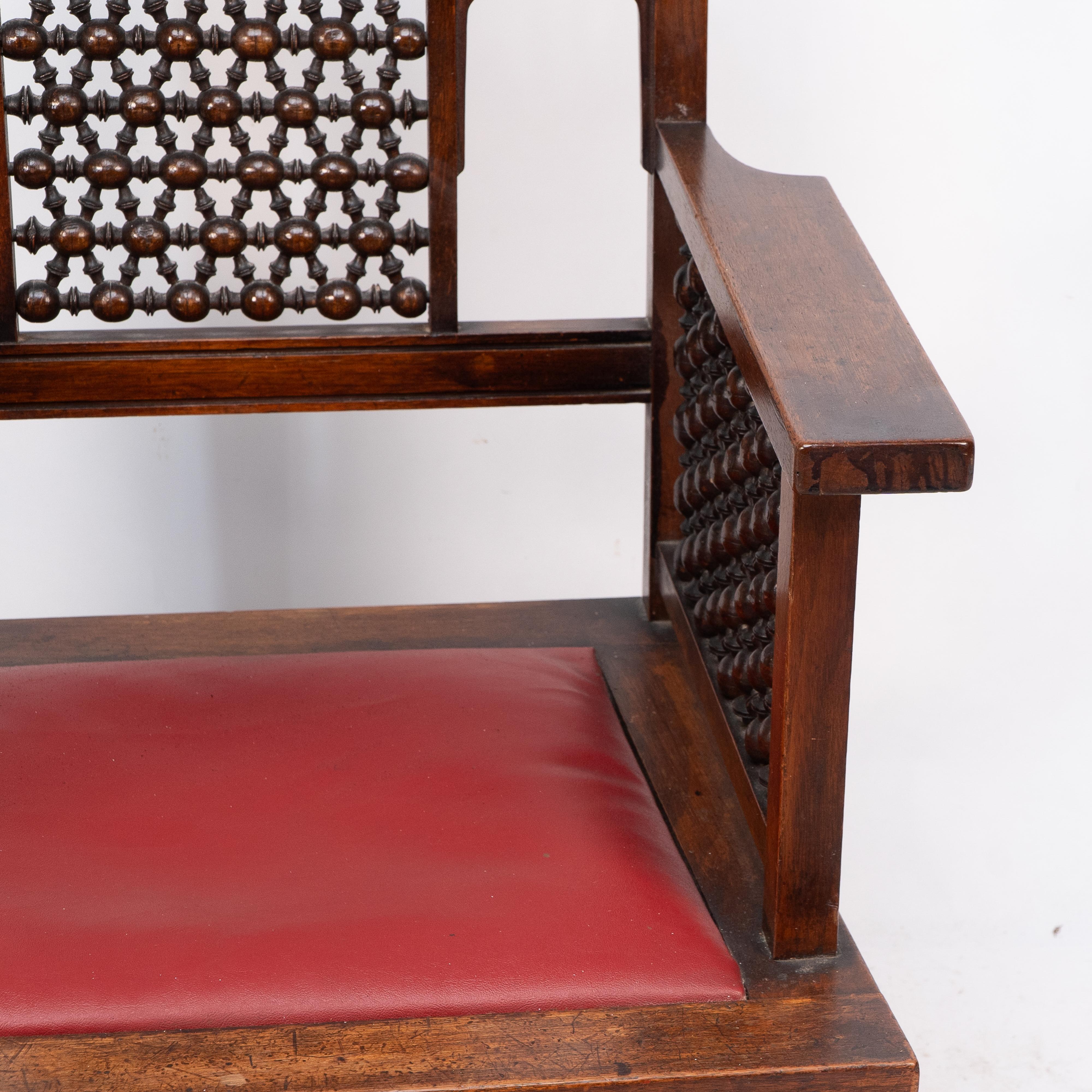 Liberty & Co A Moorish walnut armchair with Mashrabiya turned details throughout For Sale 2
