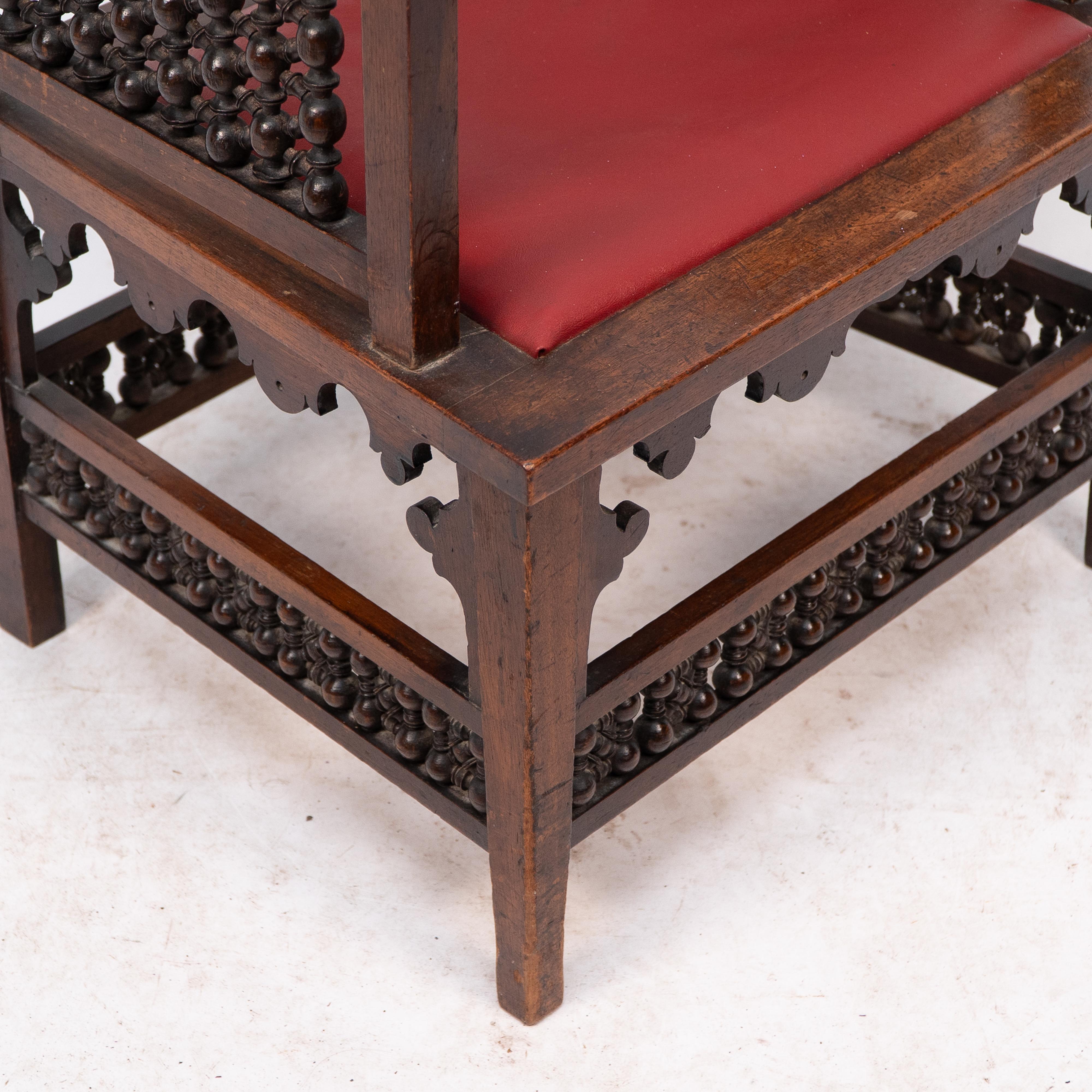 Liberty & Co A Moorish walnut armchair with Mashrabiya turned details throughout For Sale 3
