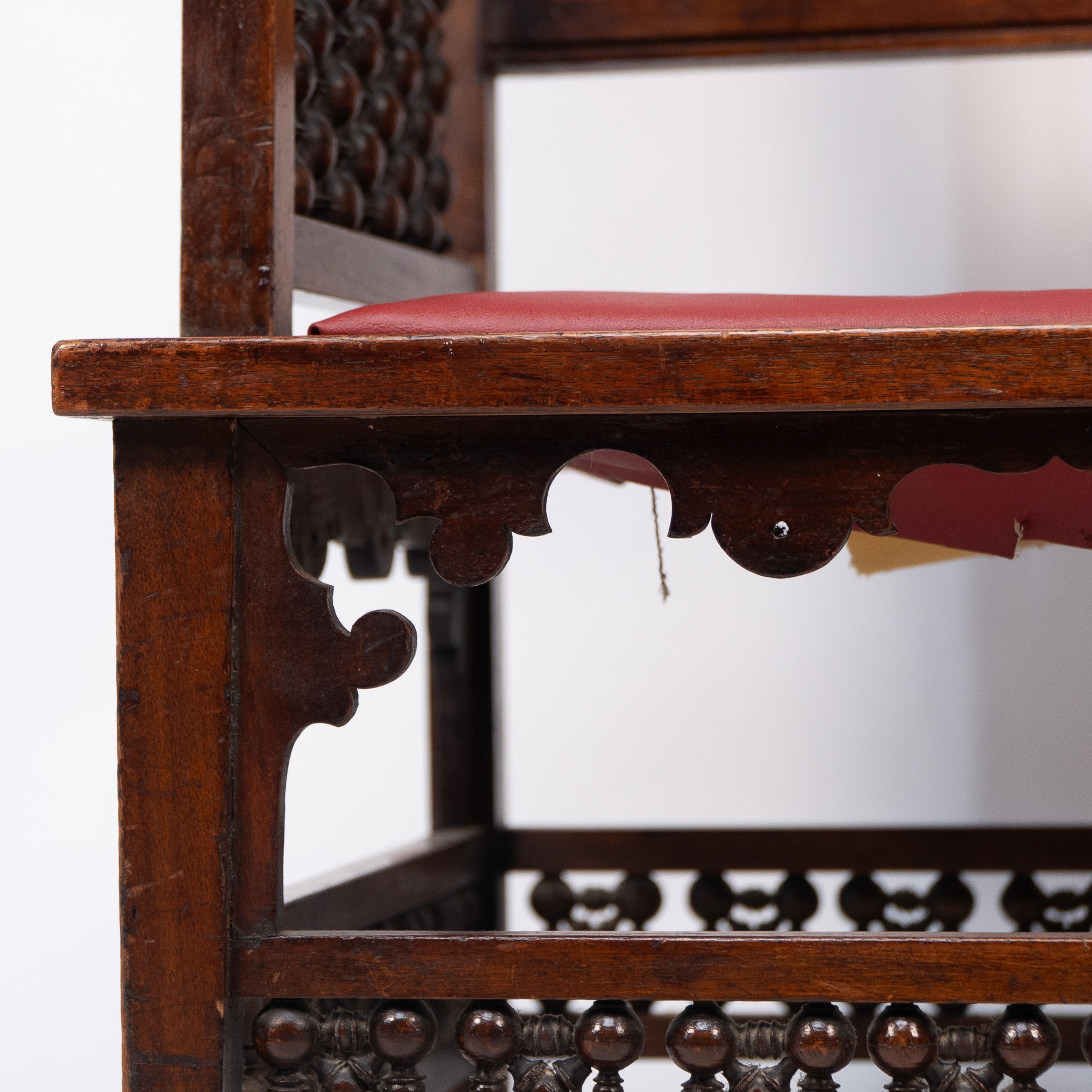 Liberty & Co A Moorish walnut armchair with Mashrabiya turned details throughout For Sale 4