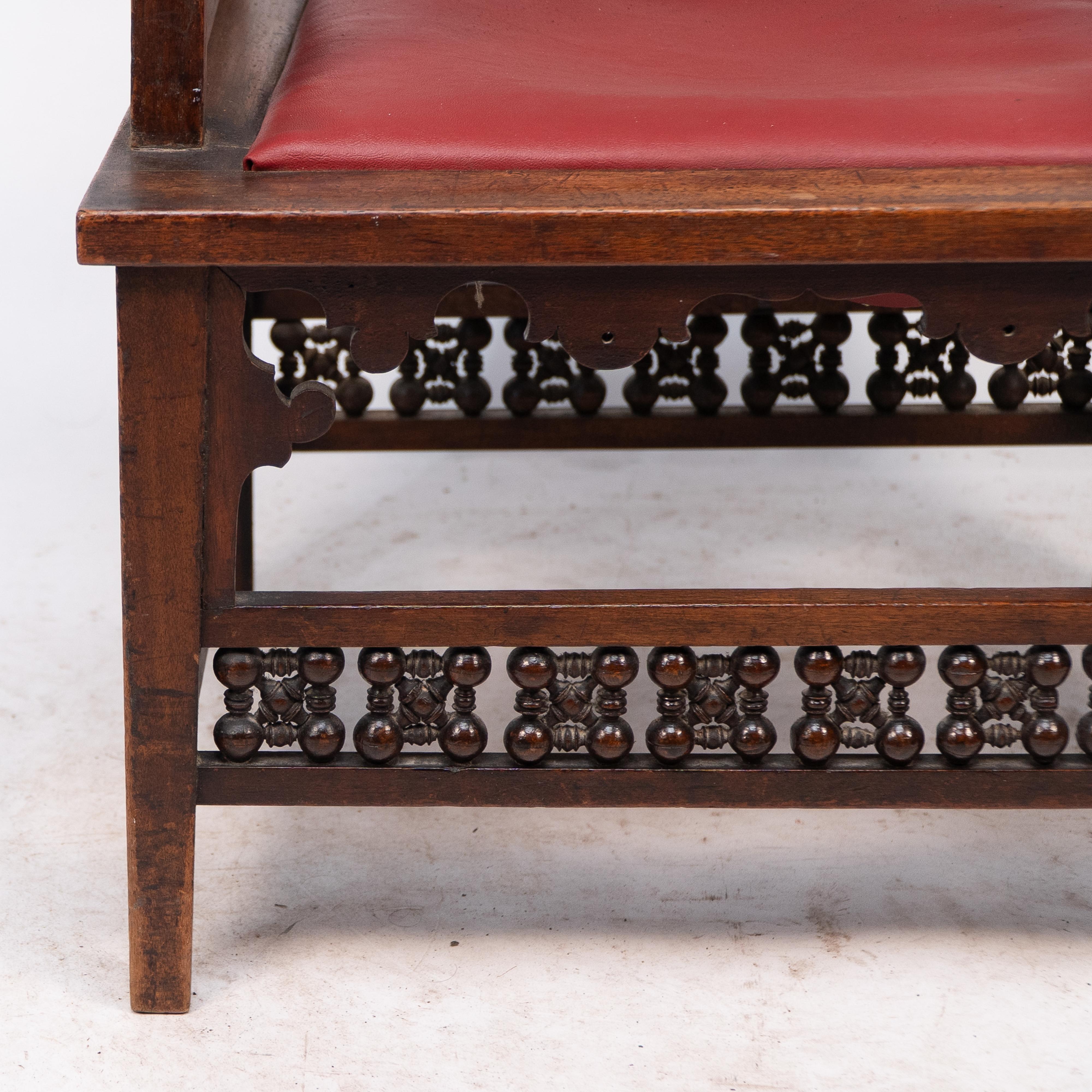 Liberty & Co A Moorish walnut armchair with Mashrabiya turned details throughout For Sale 5