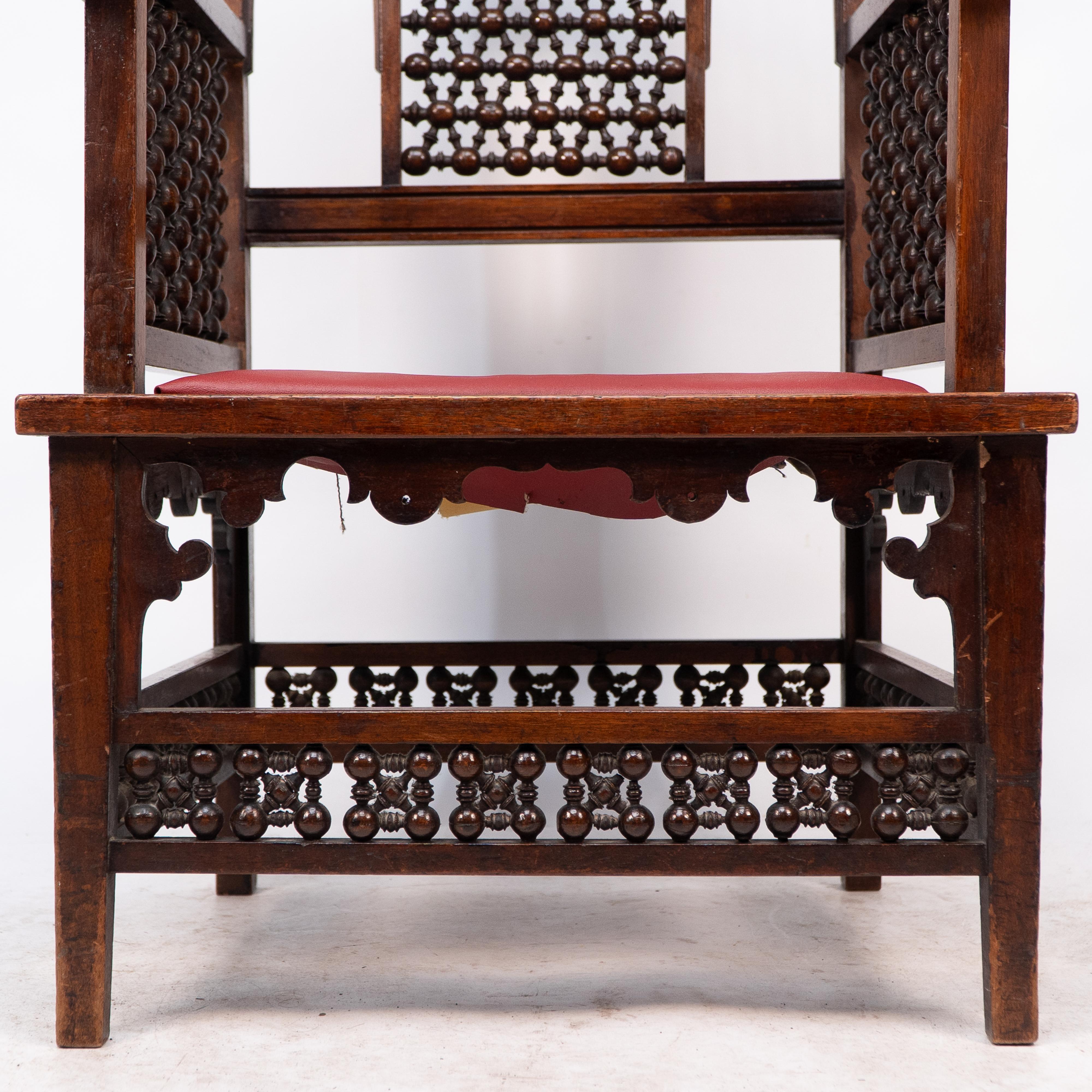 Liberty & Co A Moorish walnut armchair with Mashrabiya turned details throughout For Sale 6
