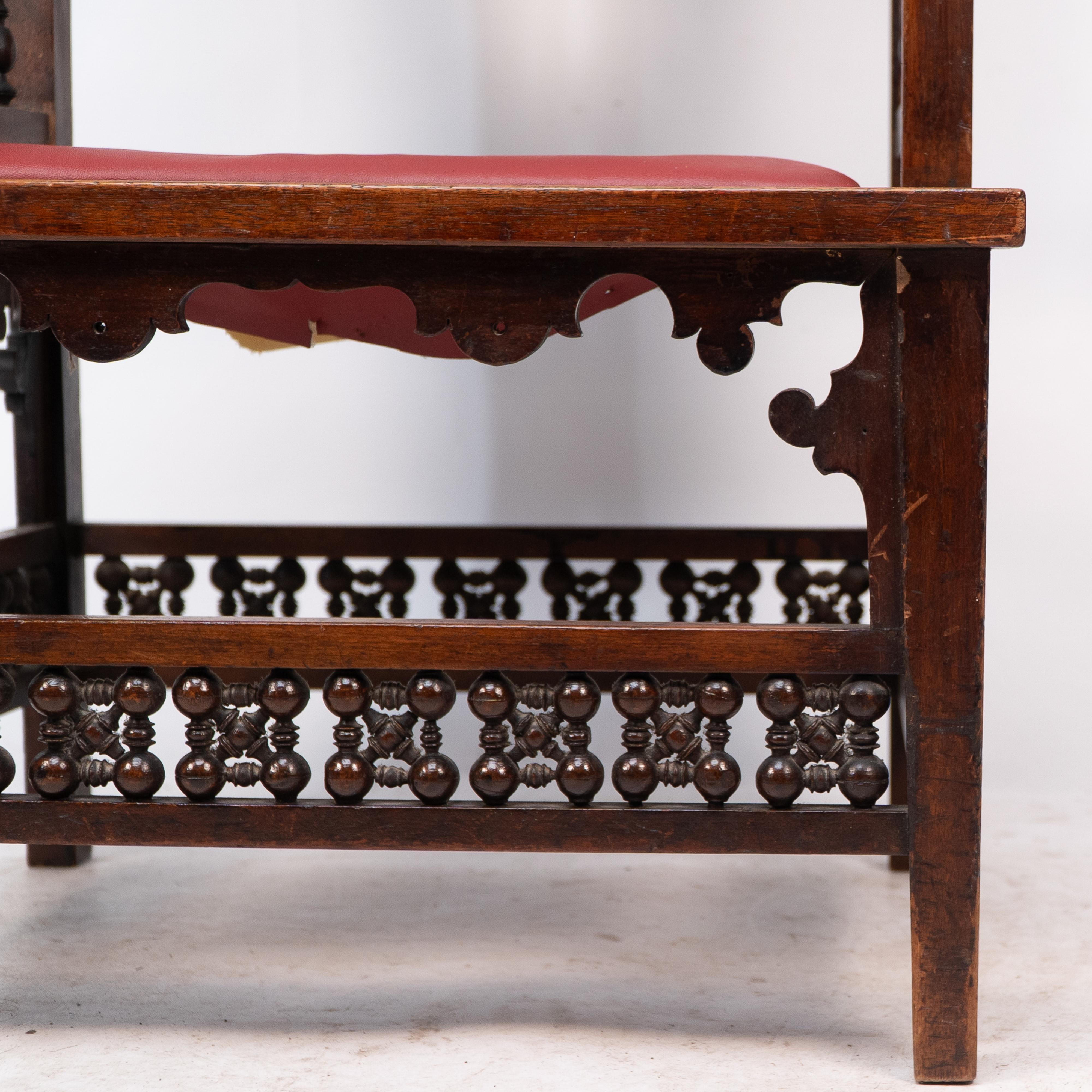 Liberty & Co A Moorish walnut armchair with Mashrabiya turned details throughout For Sale 8
