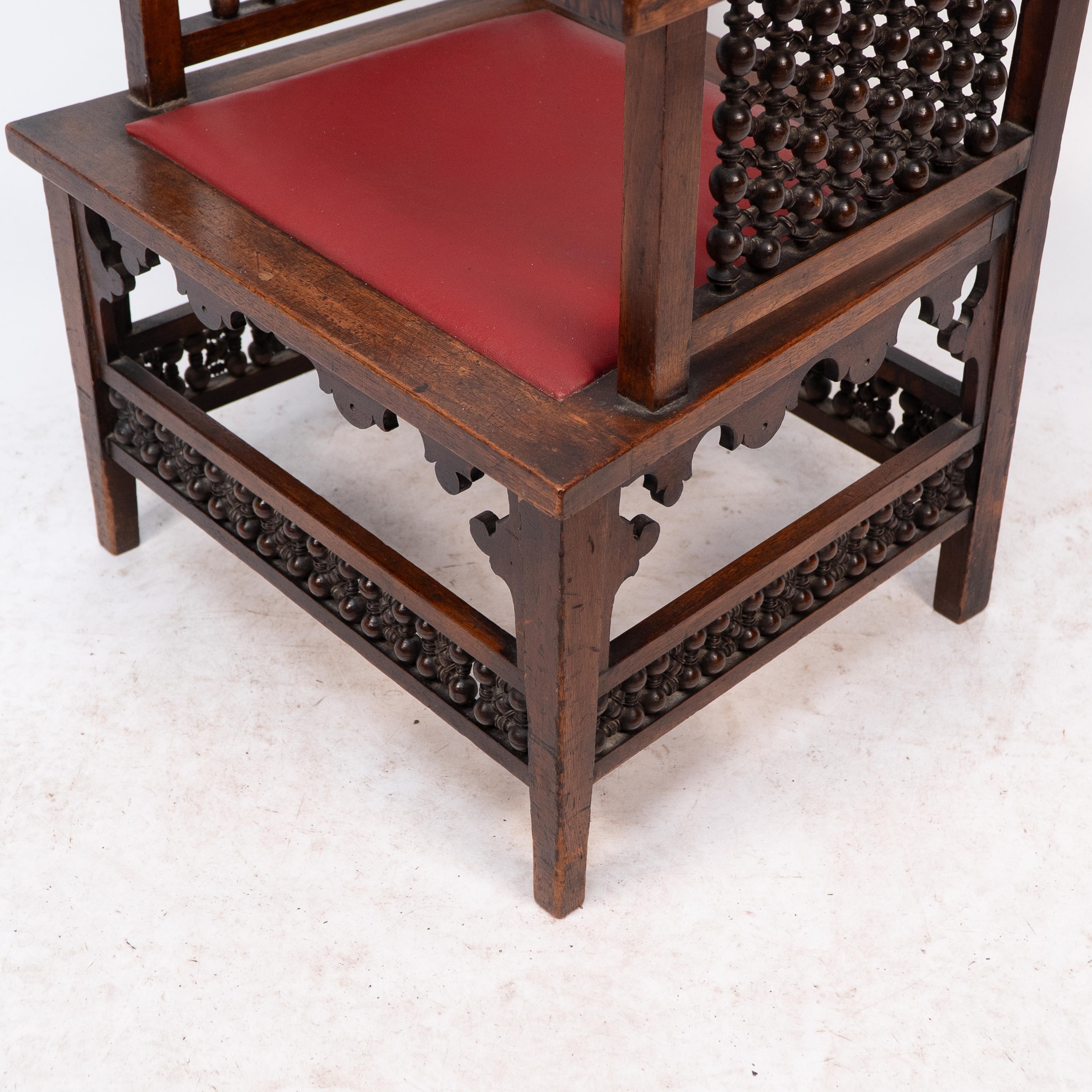Liberty & Co A Moorish walnut armchair with Mashrabiya turned details throughout For Sale 9