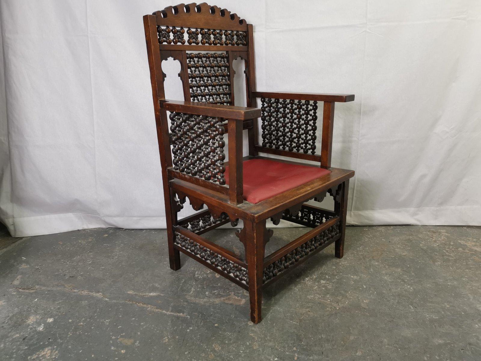 English Liberty & Co a Moorish Walnut Armchair with Mashrabiya Turned Details Throughout For Sale