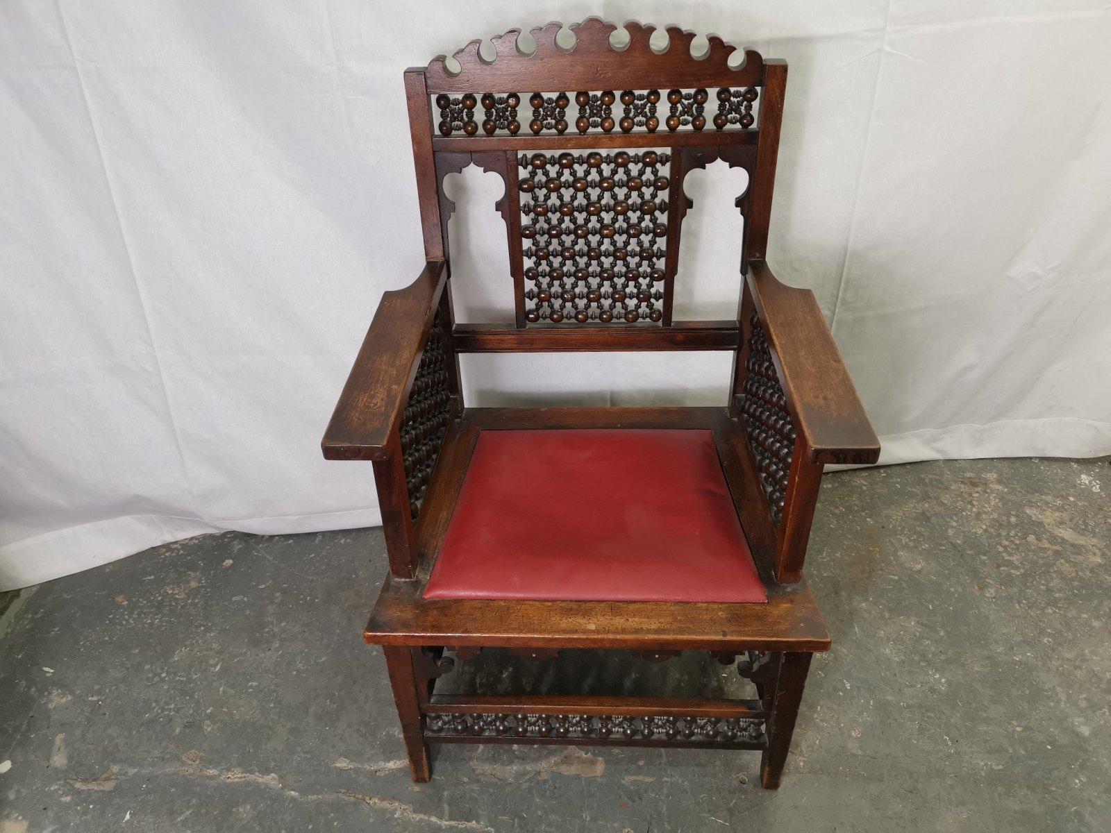 Liberty & Co a Moorish Walnut Armchair with Mashrabiya Turned Details Throughout In Good Condition For Sale In London, GB