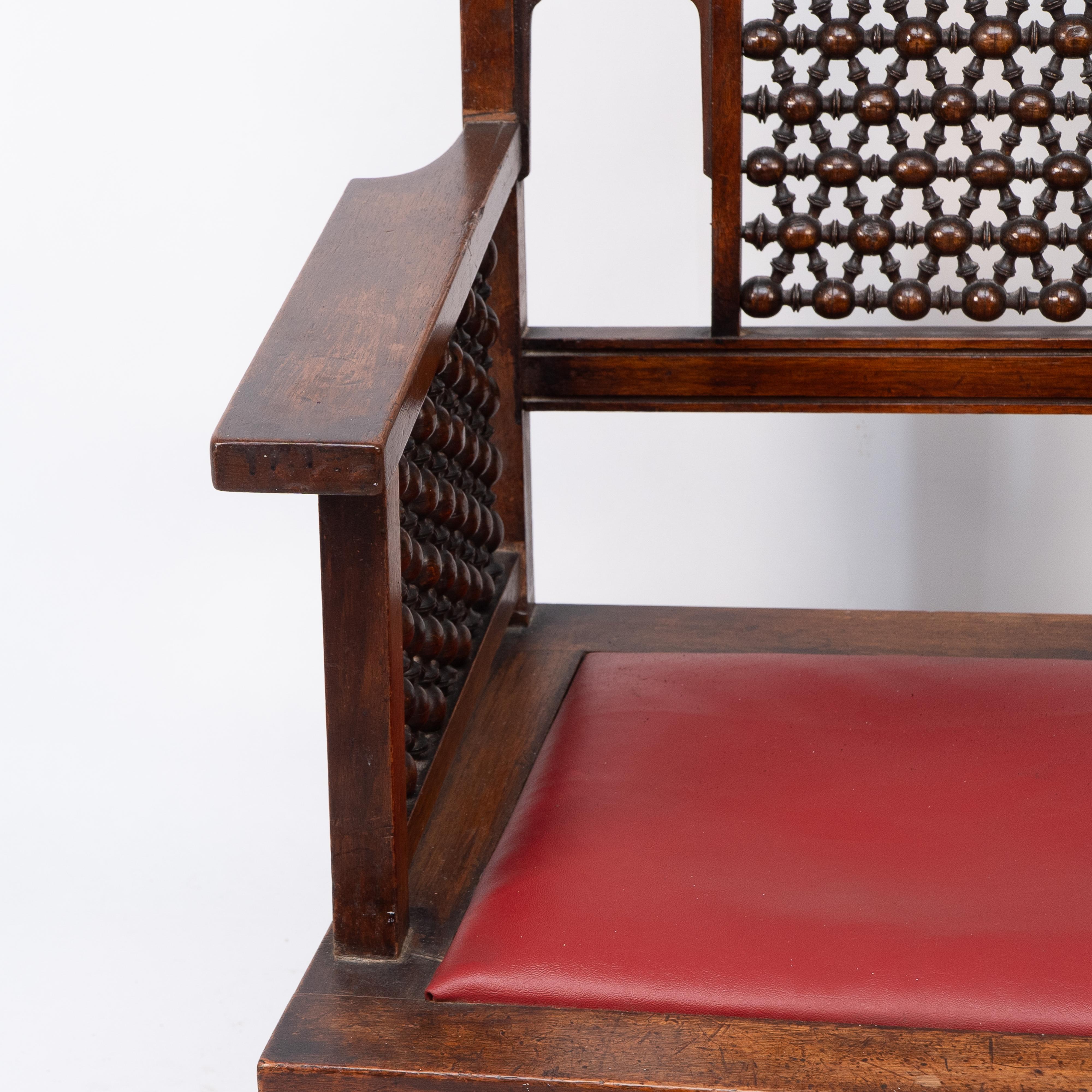 Walnut Liberty & Co A Moorish walnut armchair with Mashrabiya turned details throughout For Sale