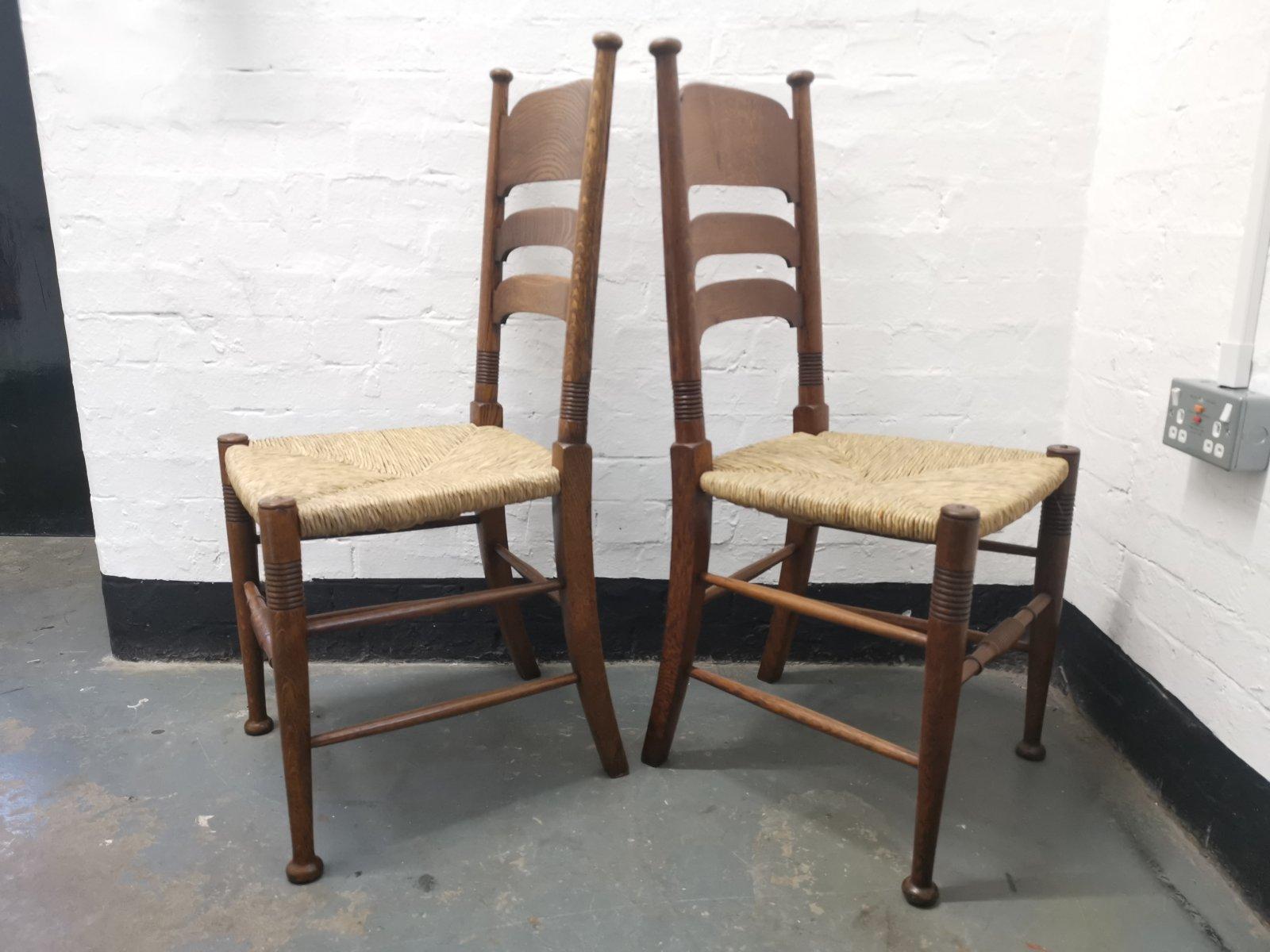 English Liberty & Co. a Pair of William Birch Arts & Crafts Oak Rush Seat Dining Chairs For Sale