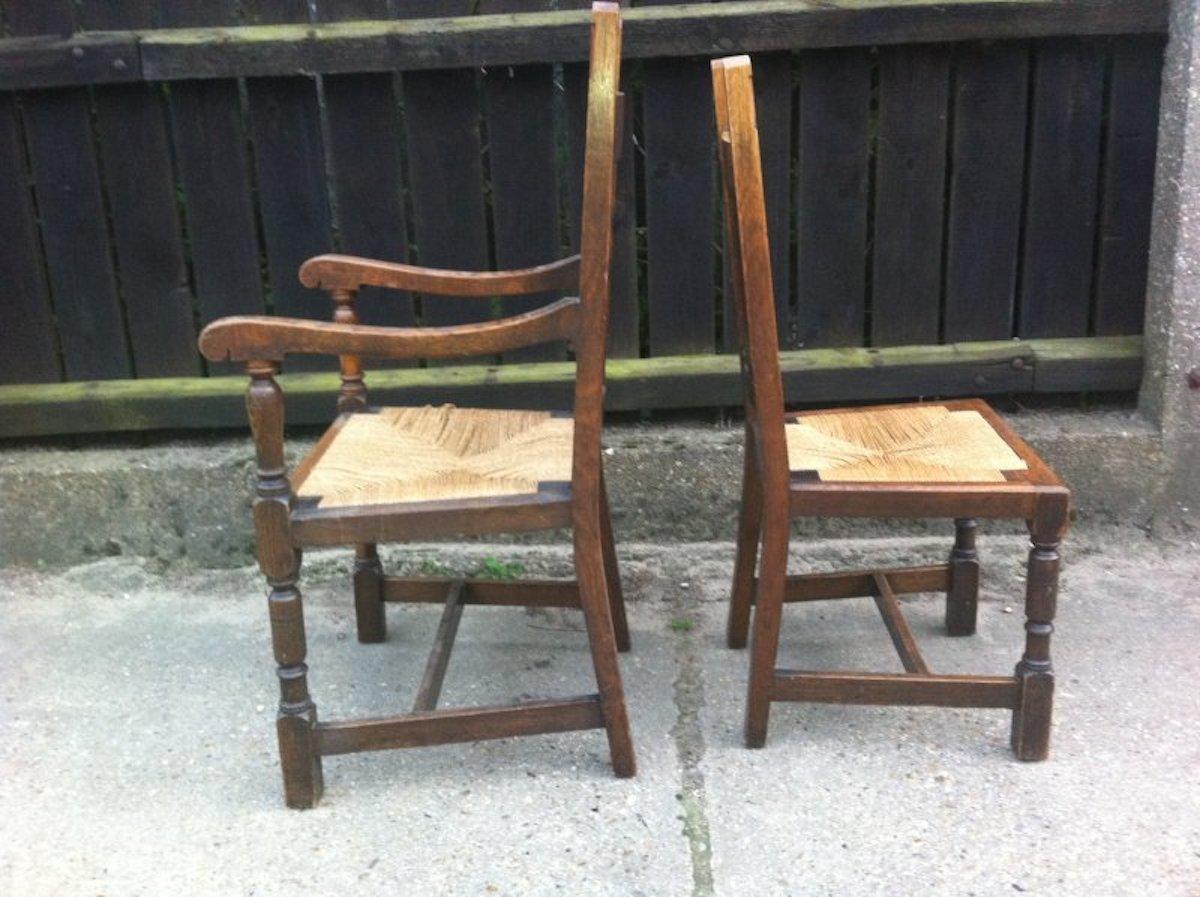 Arts and Crafts Liberty & Co. a Set of Six Arts & Crafts Oak Arrow Head Rush Seat Dining Chairs For Sale