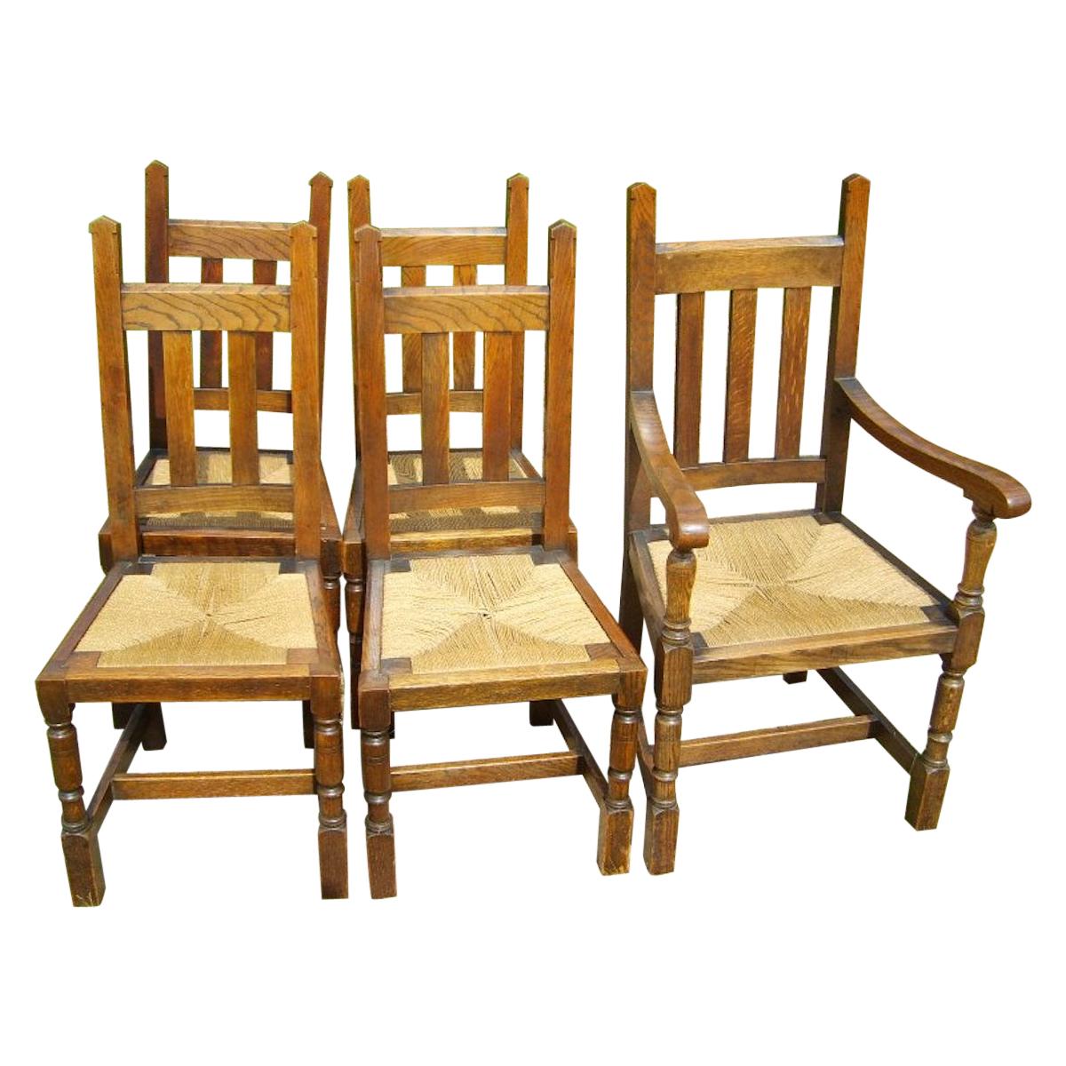 Liberty & Co. a Set of Six Arts & Crafts Oak Arrow Head Rush Seat Dining Chairs For Sale