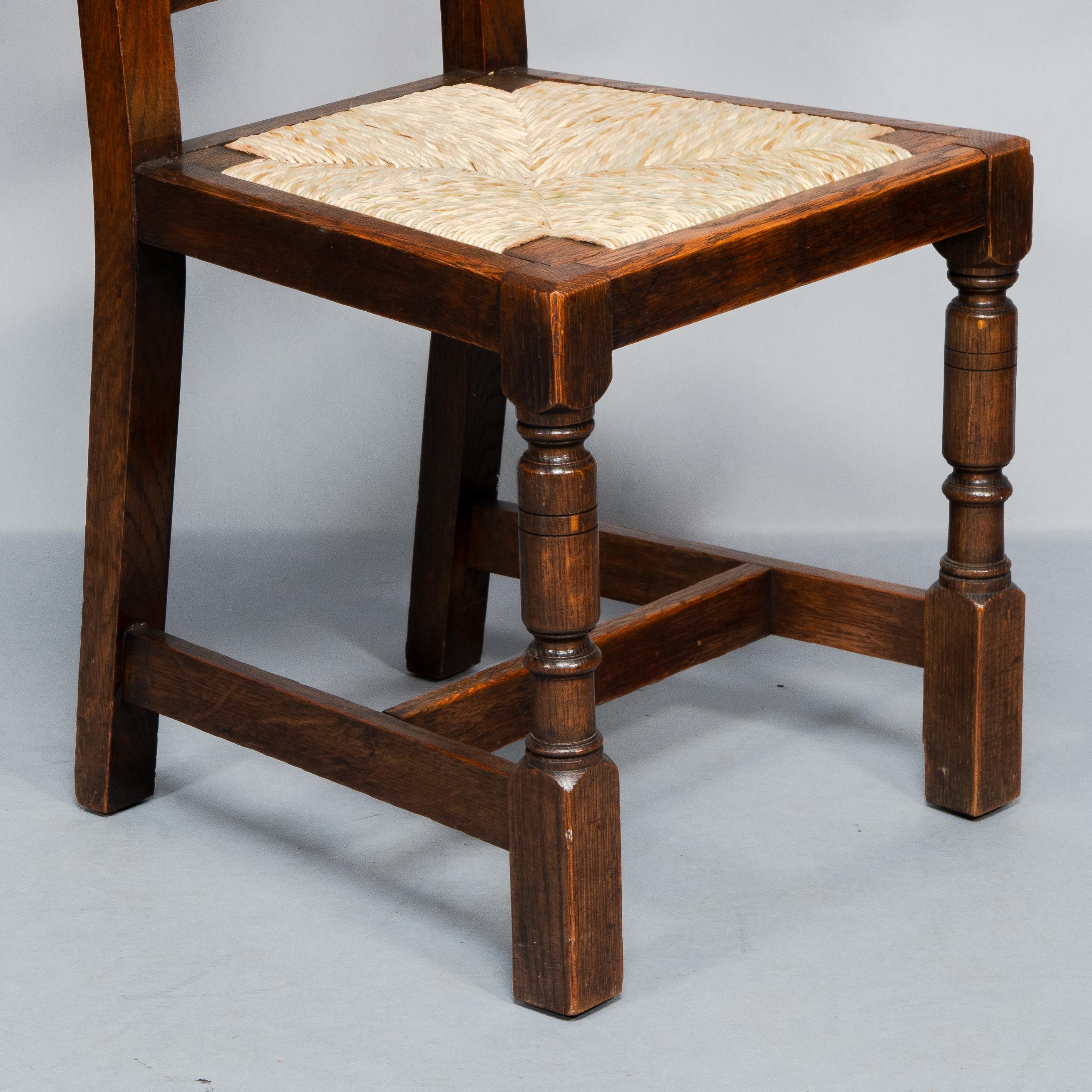 Liberty & Co. A Set of Six Arts & Crafts Oak Arrowhead Rush Seat Dining Chairs. For Sale 7