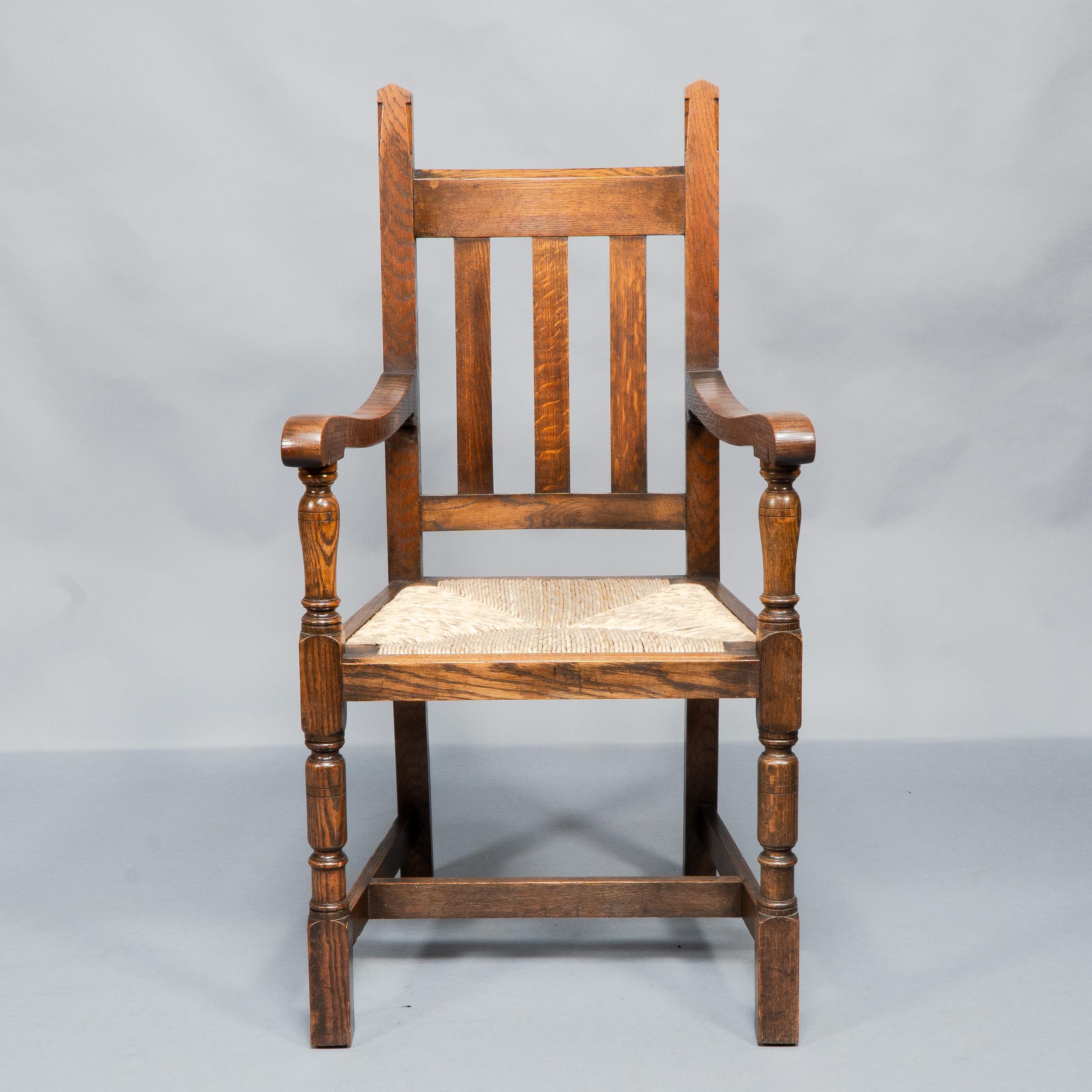 Liberty & Co. A Set of Six Arts & Crafts Oak Arrowhead Rush Seat Dining Chairs. For Sale 8
