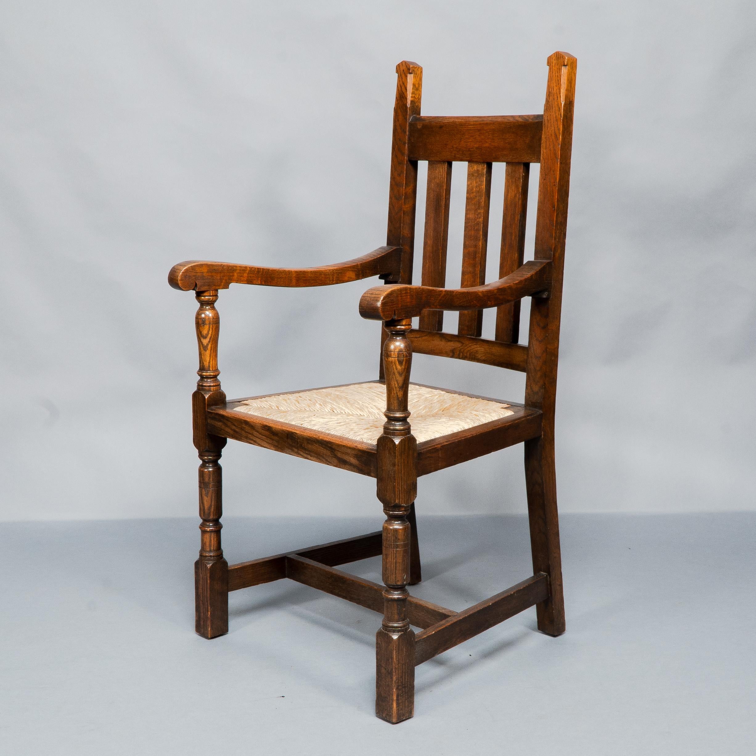 Liberty & Co. A Set of Six Arts & Crafts Oak Arrowhead Rush Seat Dining Chairs. For Sale 9