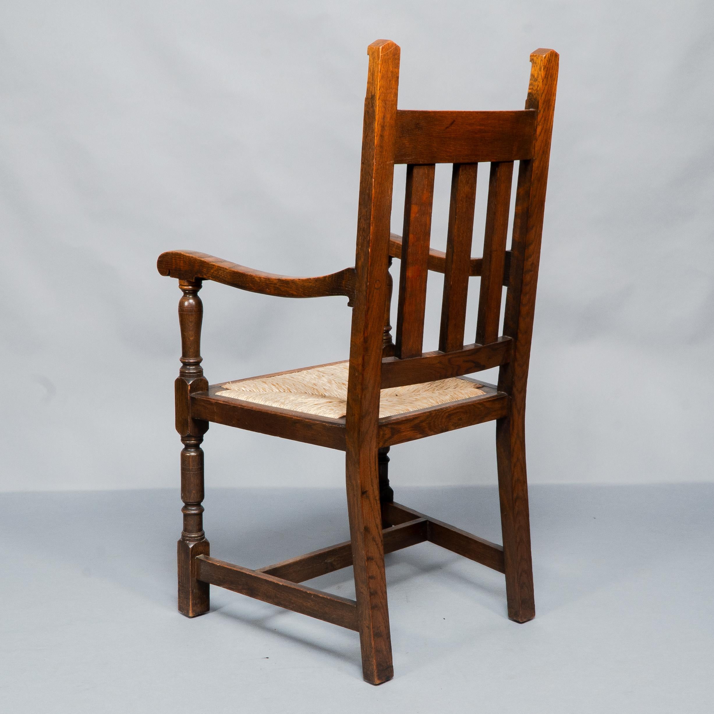 Liberty & Co. A Set of Six Arts & Crafts Oak Arrowhead Rush Seat Dining Chairs. For Sale 10