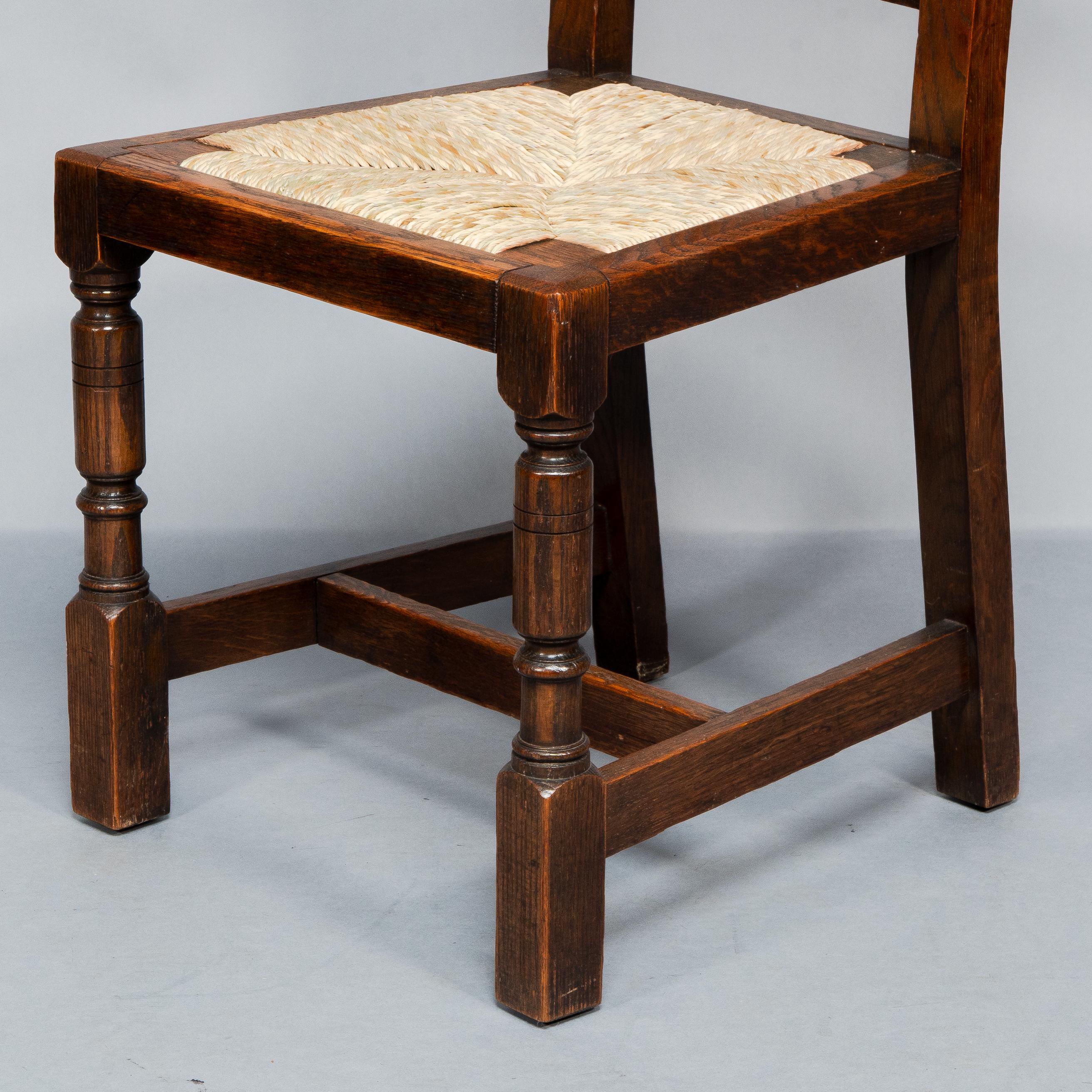 Liberty & Co. A Set of Six Arts & Crafts Oak Arrowhead Rush Seat Dining Chairs. For Sale 5