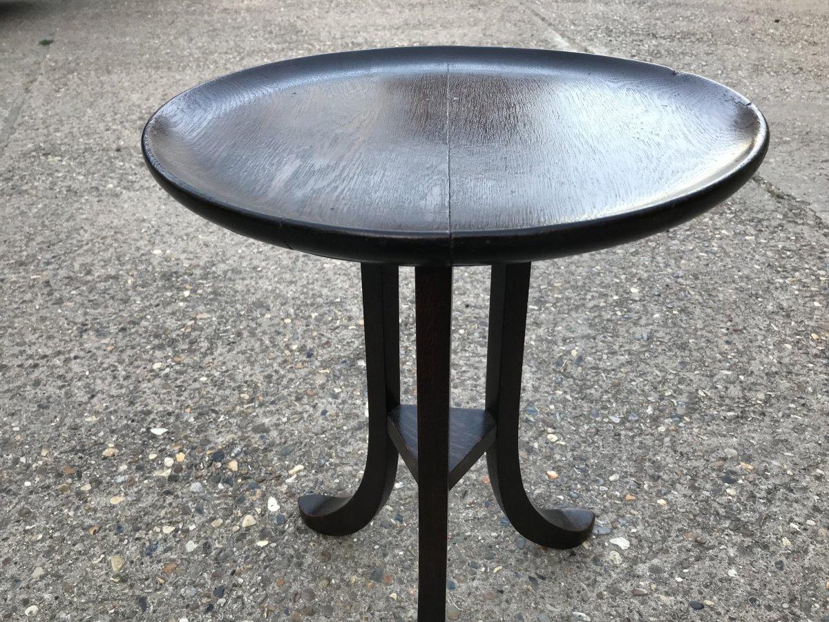 Liberty & Co. a rare Thebes walnut side table with three splayed legs retaining the original
Ceramic plaque underneath - 'Liberty & Co. ,London, W'.