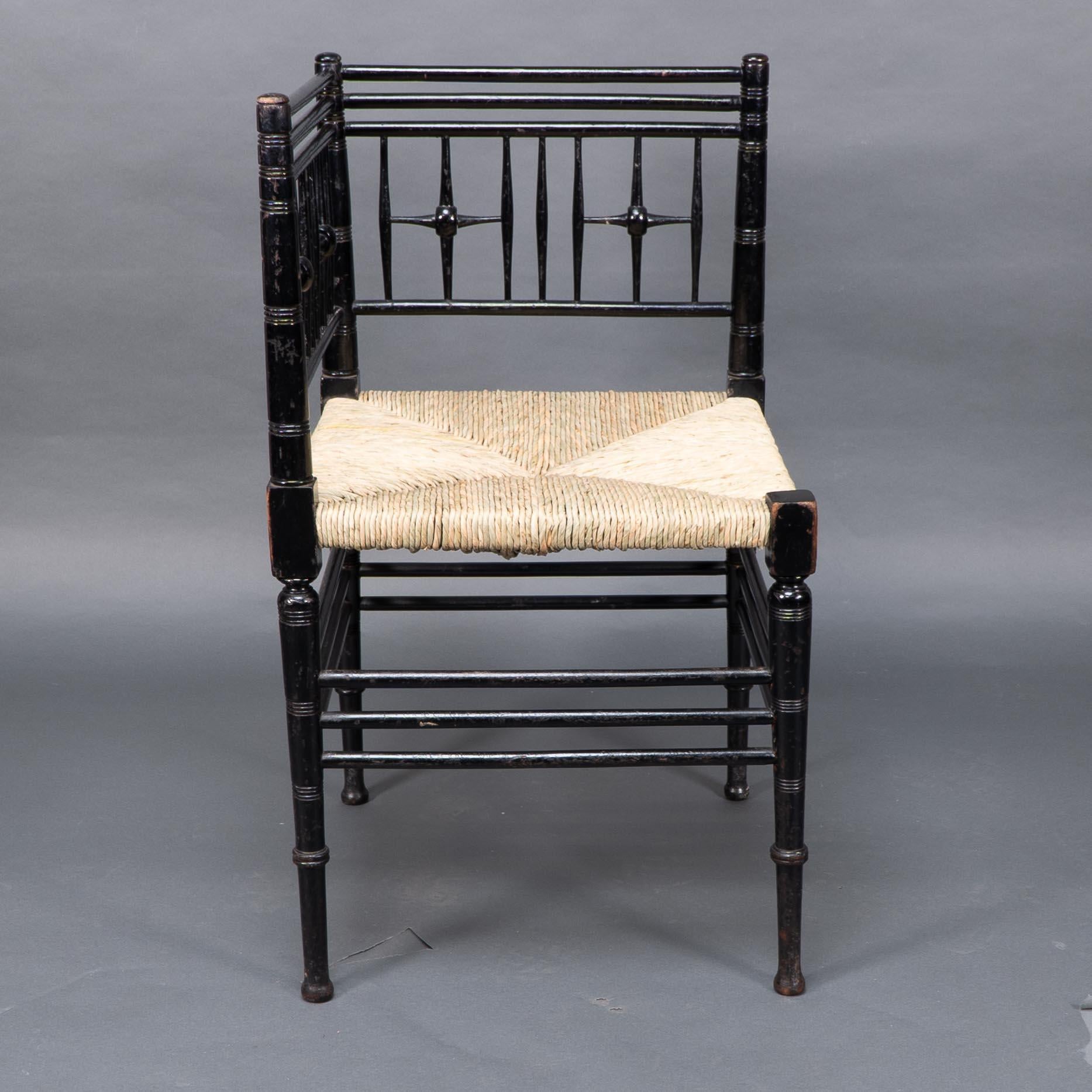 Late 19th Century Liberty & Co. Aesthetic Movement ebonized corner armchair from the Argyll suite