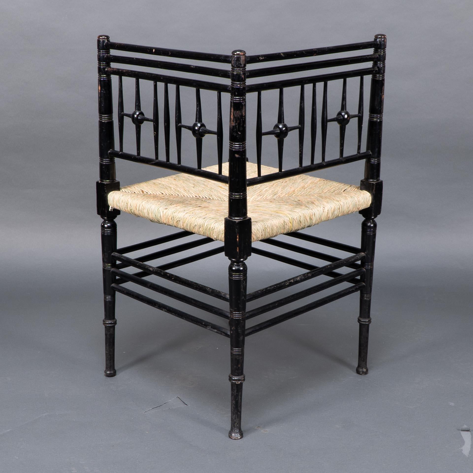 English Liberty & Co. Aesthetic Movement ebonized corner armchair from the Argyll suite For Sale