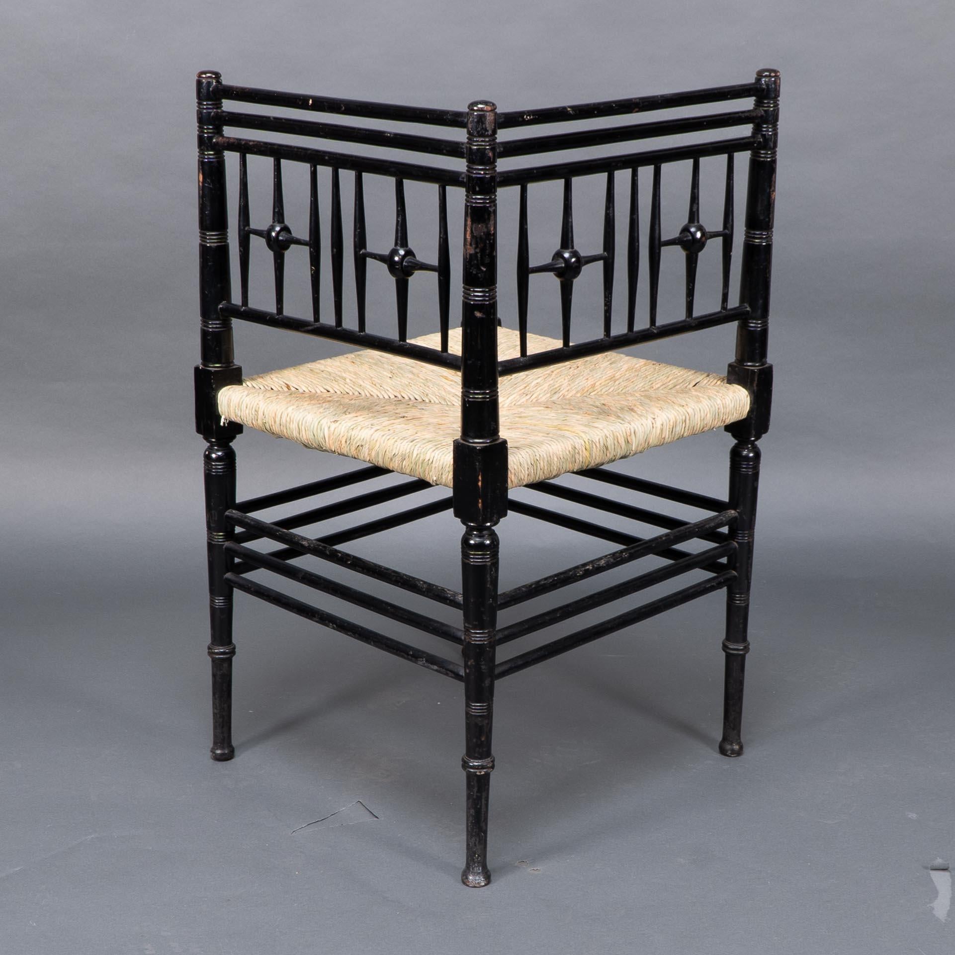 English Liberty & Co. Aesthetic Movement ebonized corner armchair from the Argyll suite