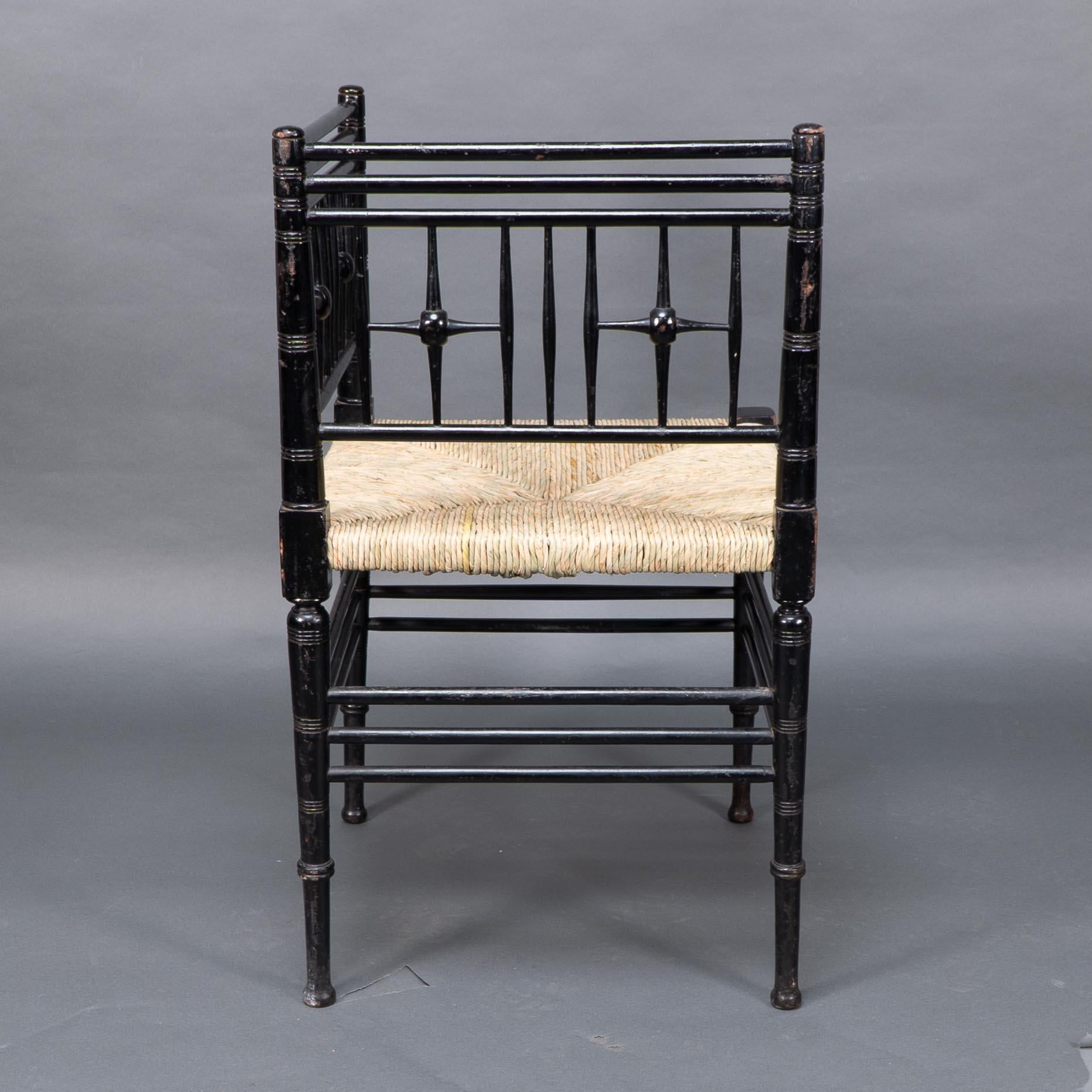Ebonized Liberty & Co. Aesthetic Movement ebonized corner armchair from the Argyll suite For Sale