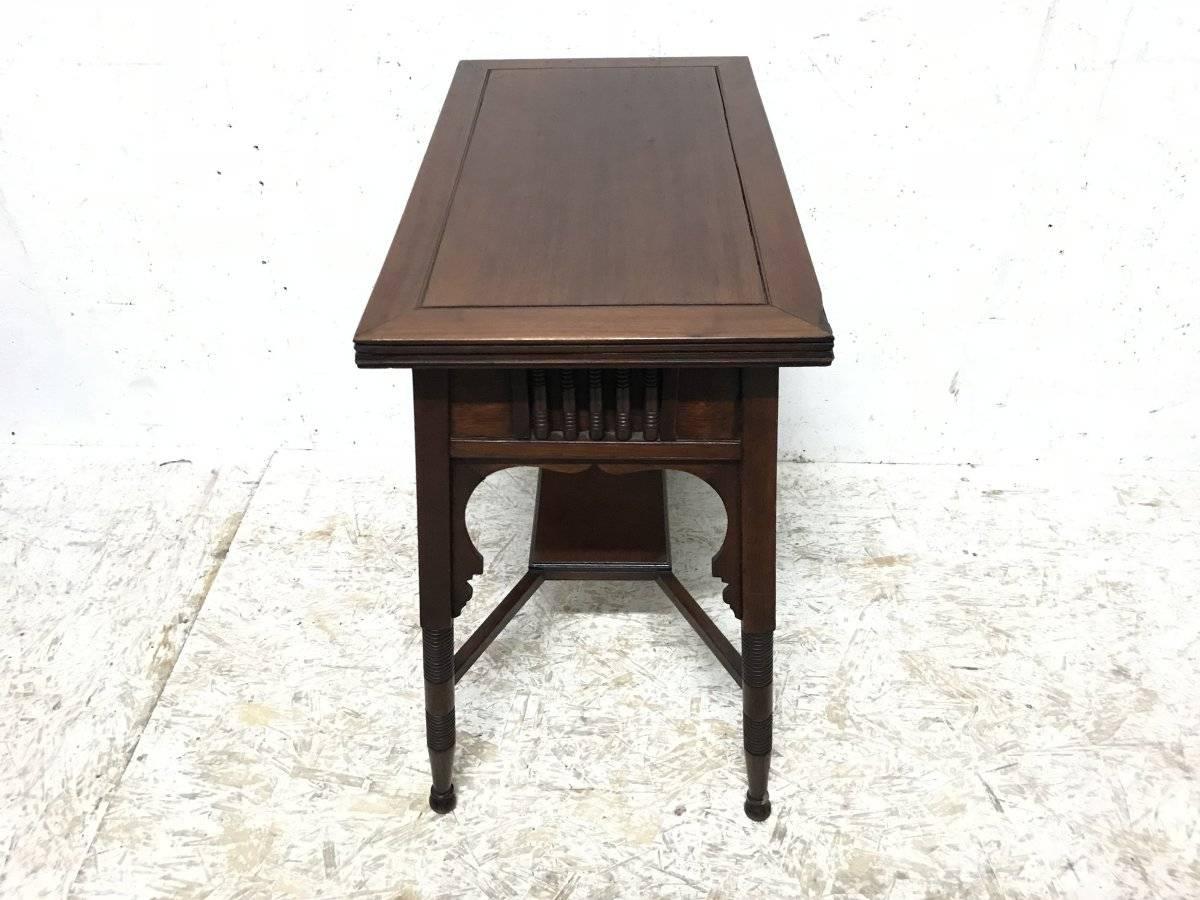 Arts and Crafts Liberty & Co. an Anglo-Moorish Arts & Crafts Walnut Fold over Card & Games Table For Sale