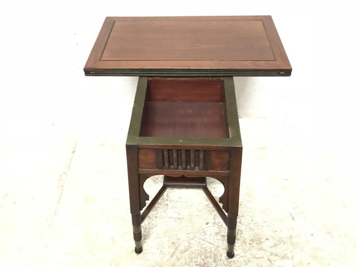 English Liberty & Co. an Anglo-Moorish Arts & Crafts Walnut Fold over Card & Games Table For Sale