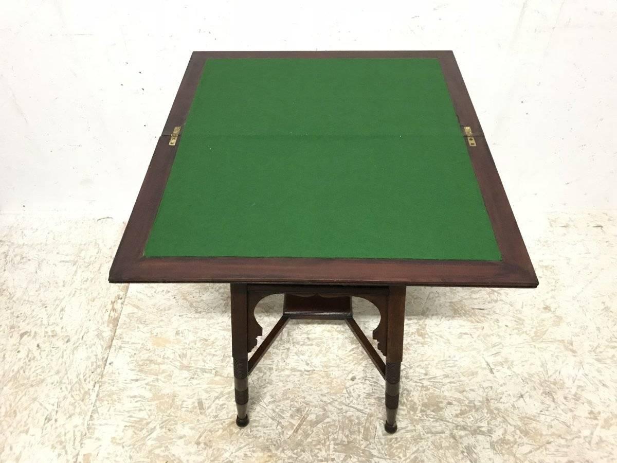 Hand-Crafted Liberty & Co. an Anglo-Moorish Arts & Crafts Walnut Fold over Card & Games Table For Sale
