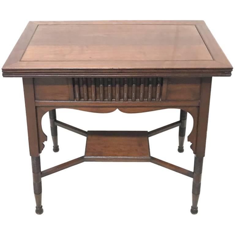 Liberty & Co. an Anglo-Moorish Arts & Crafts Walnut Fold over Card & Games Table For Sale
