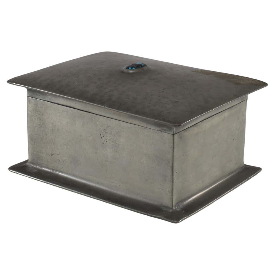 Liberty and Co. An Arts and Crafts pewter box with an enamel maiden to ...