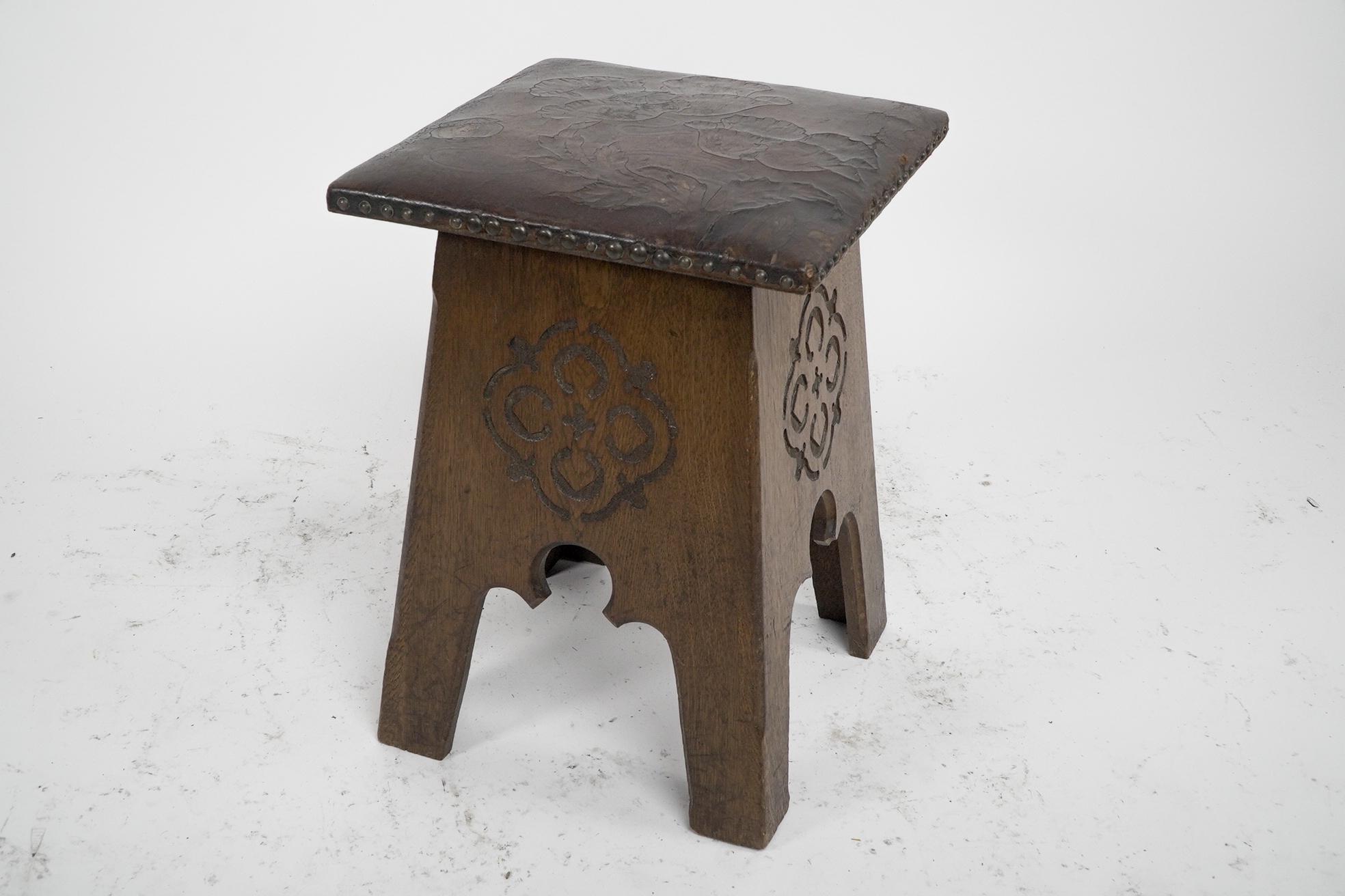 Arts and Crafts Liberty & Co, an Arts & Crafts Moorish Oak Stool with Embossed Leather Seat For Sale