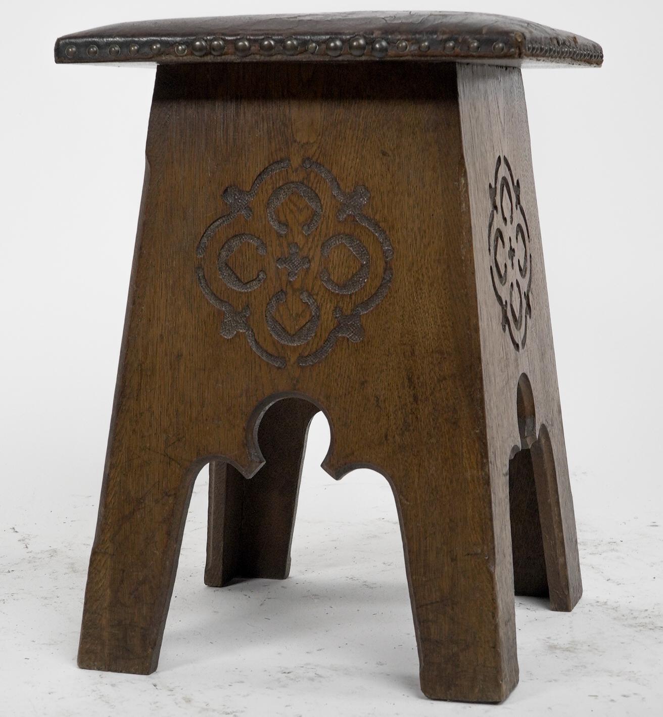 English Liberty & Co, an Arts & Crafts Moorish Oak Stool with Embossed Leather Seat For Sale