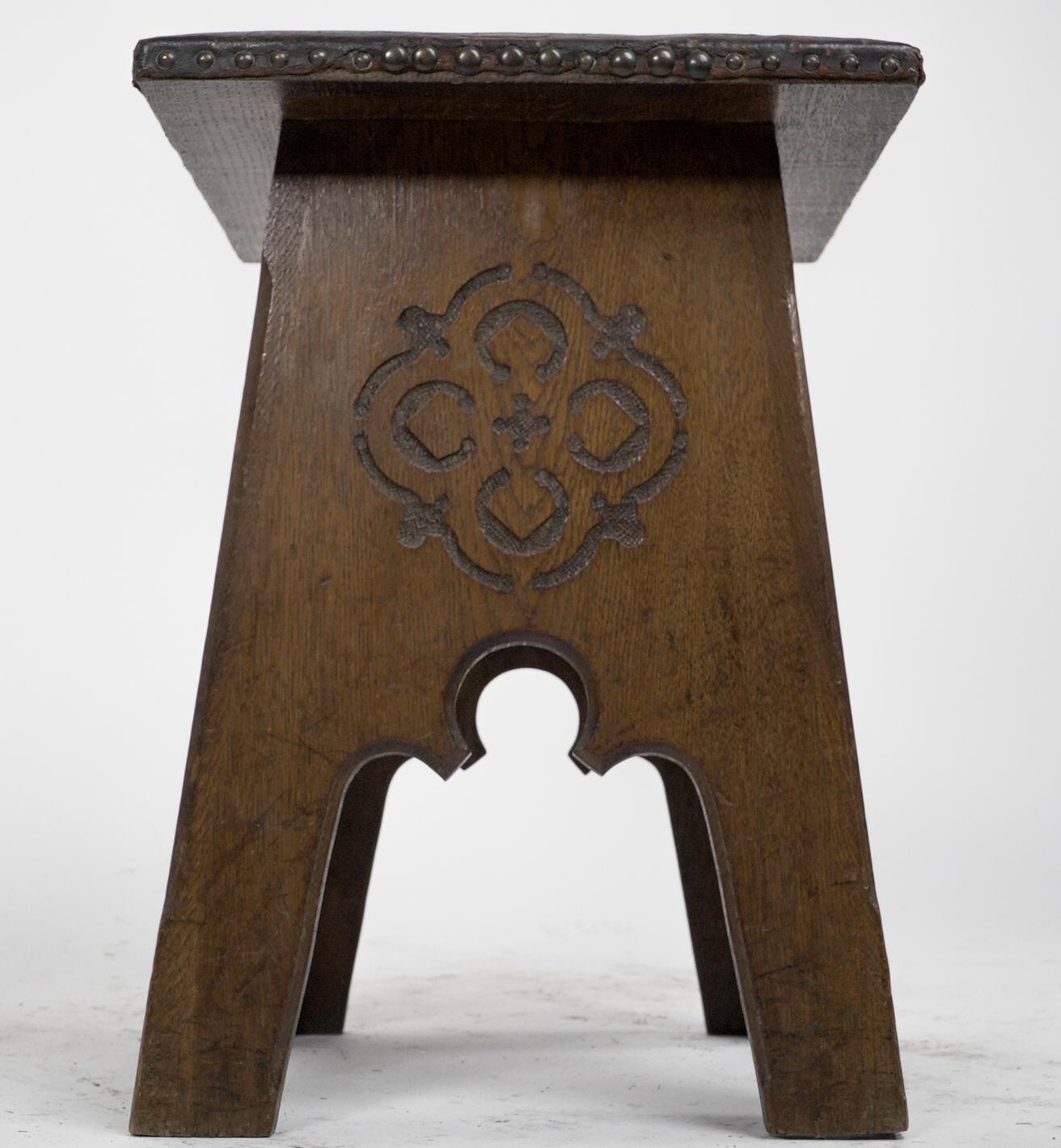 Liberty & Co, an Arts & Crafts Moorish Oak Stool with Embossed Leather Seat In Good Condition For Sale In London, GB