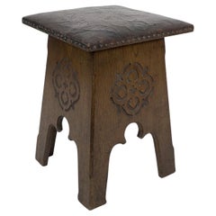 Antique Liberty & Co, an Arts & Crafts Moorish Oak Stool with Embossed Leather Seat