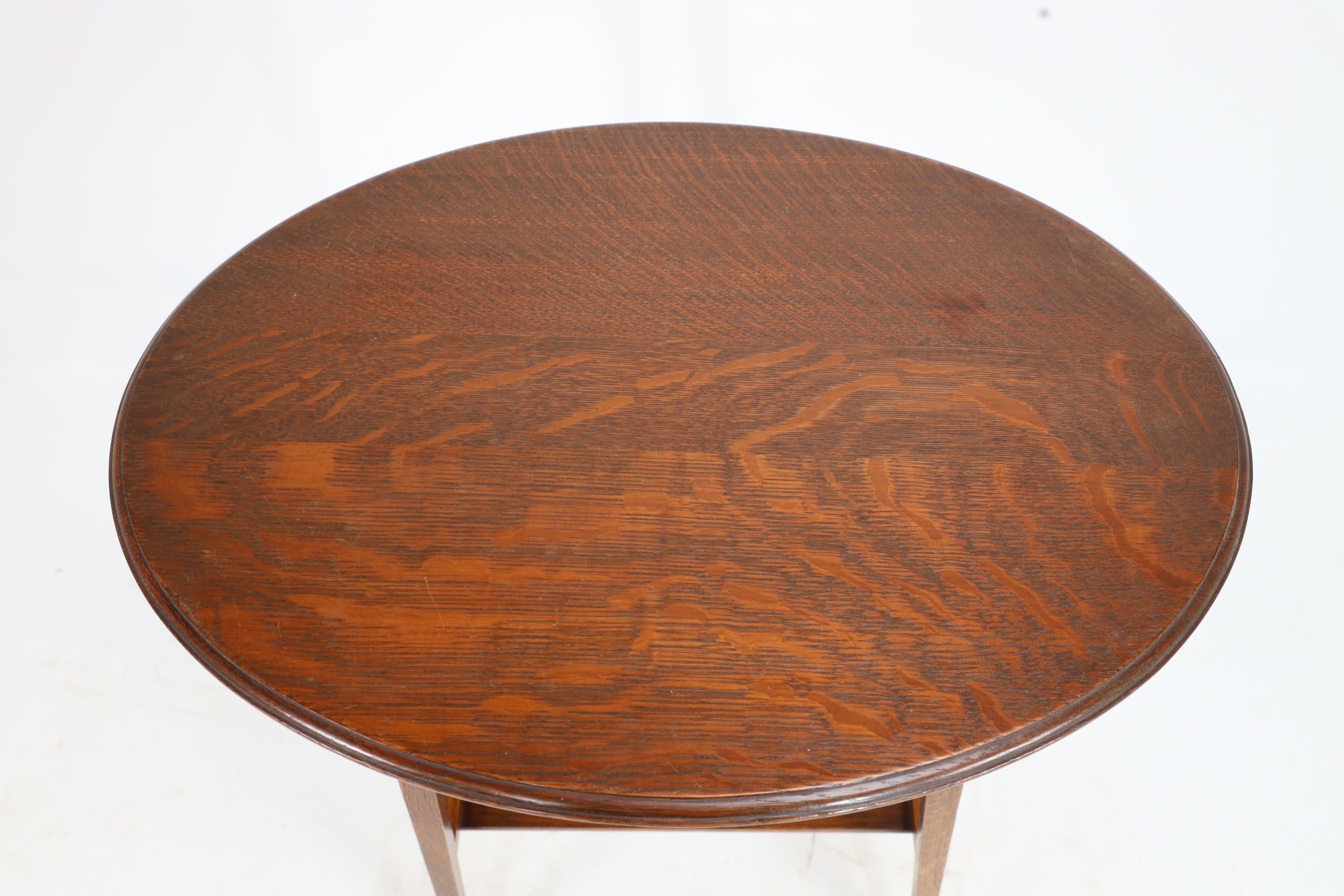 Liberty & Co. An Arts & Crafts oak oval top side table with heart cut-outs 4