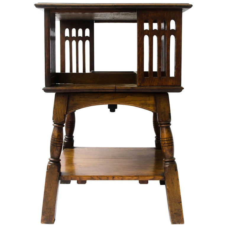Liberty and Co an Arts and Crafts Oak Revolving Bookcase Table on