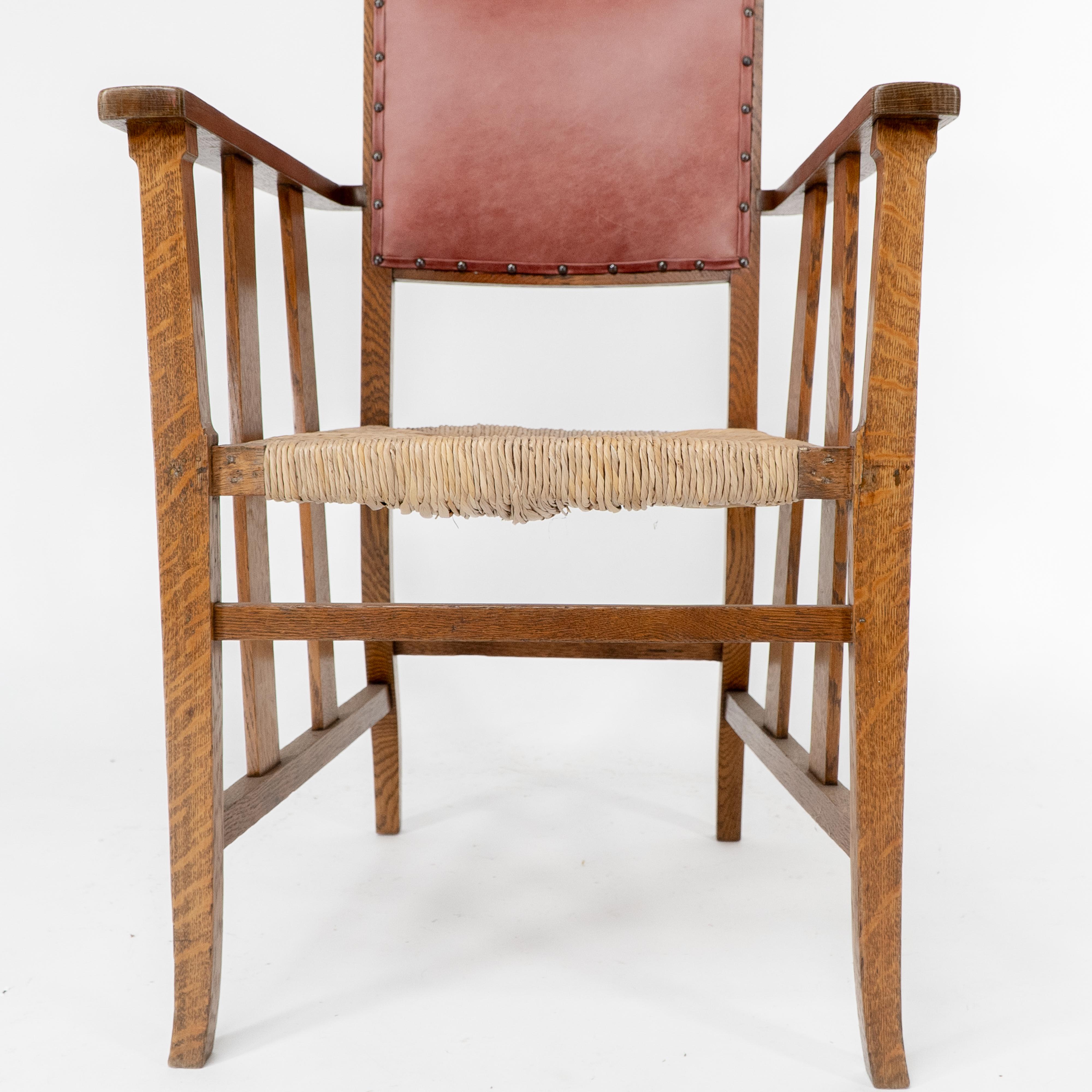 Liberty & Co. An Arts & Crafts rush seat armchair with a shaped back For Sale 5
