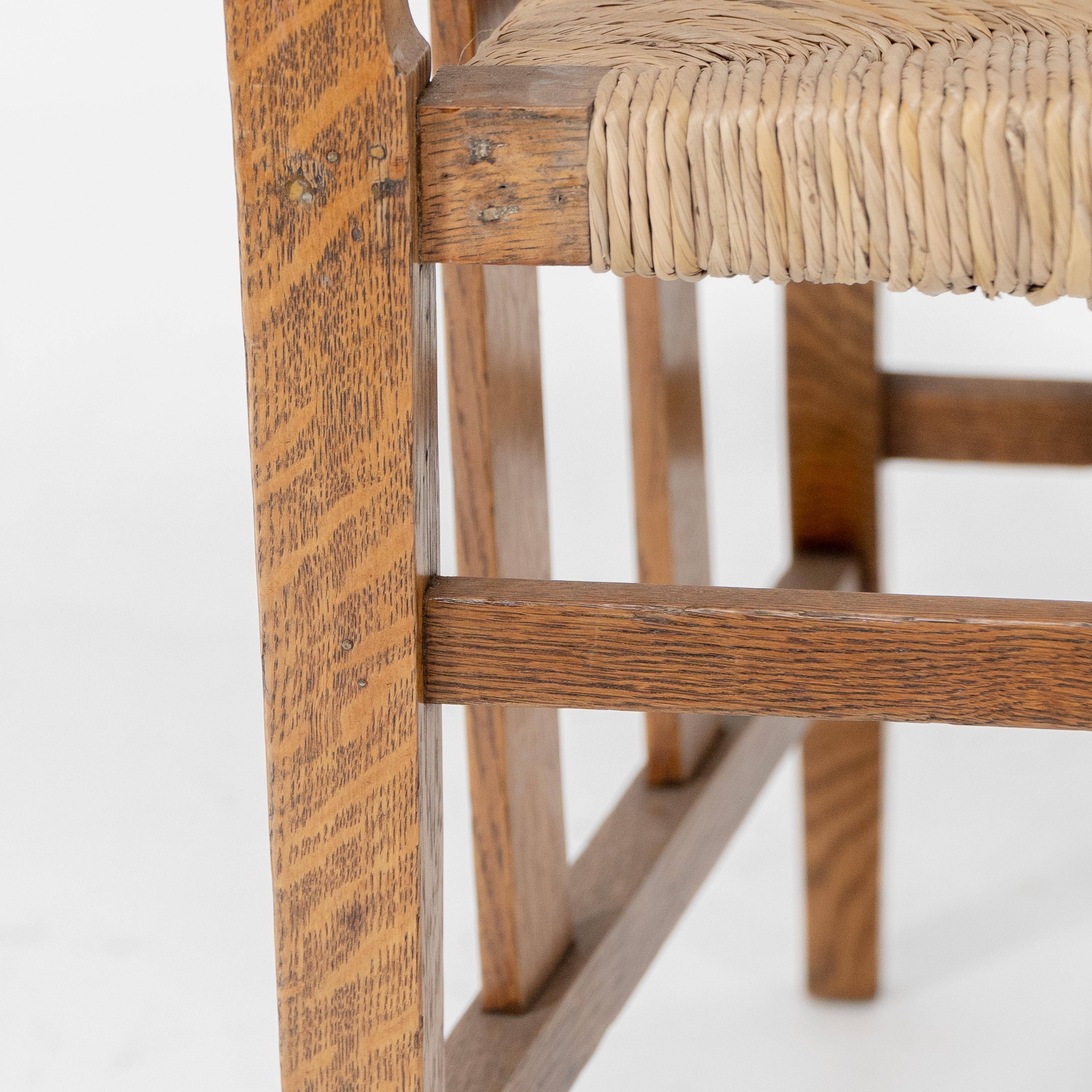 Liberty & Co. An Arts & Crafts rush seat armchair with a shaped back For Sale 6