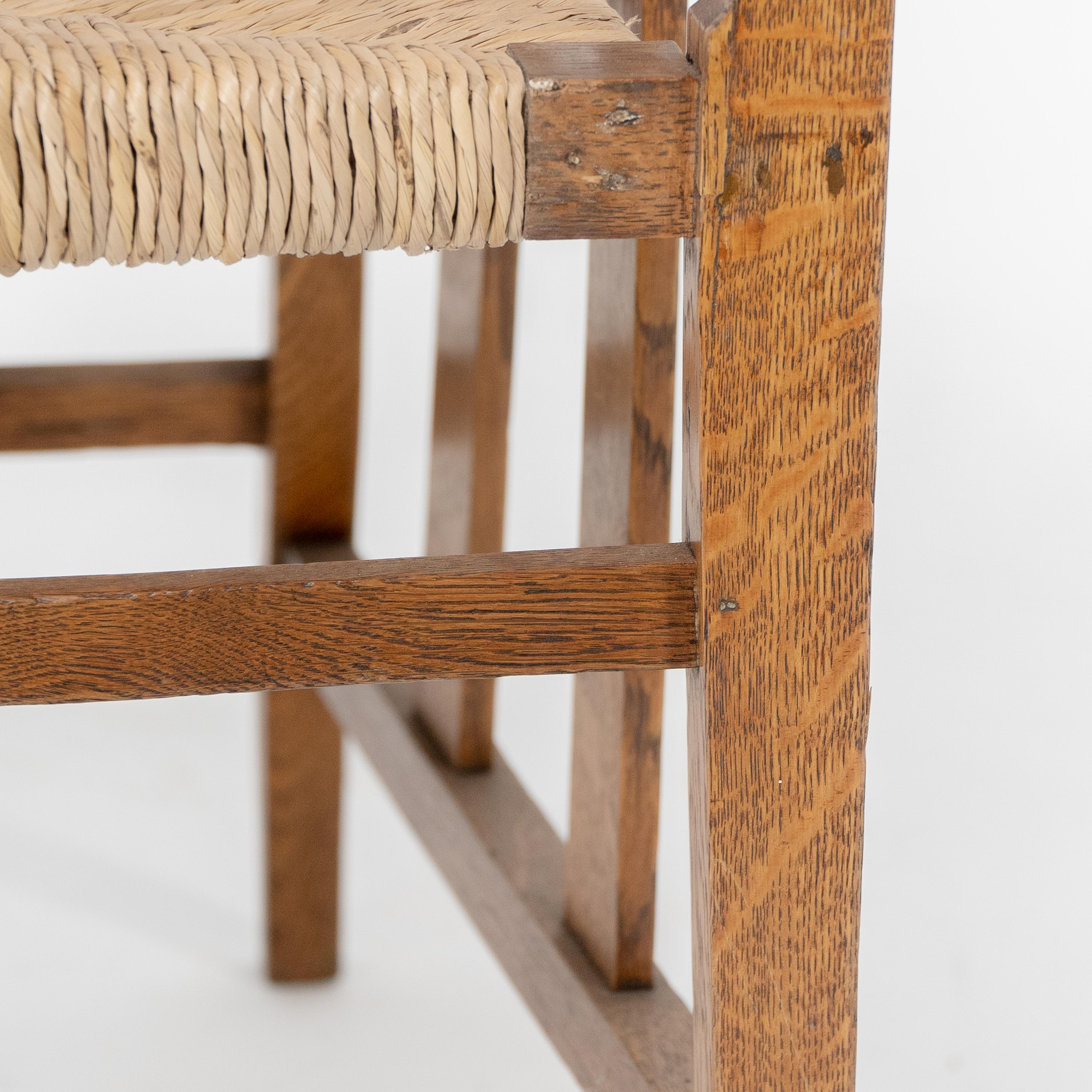 Liberty & Co. An Arts & Crafts rush seat armchair with a shaped back For Sale 7