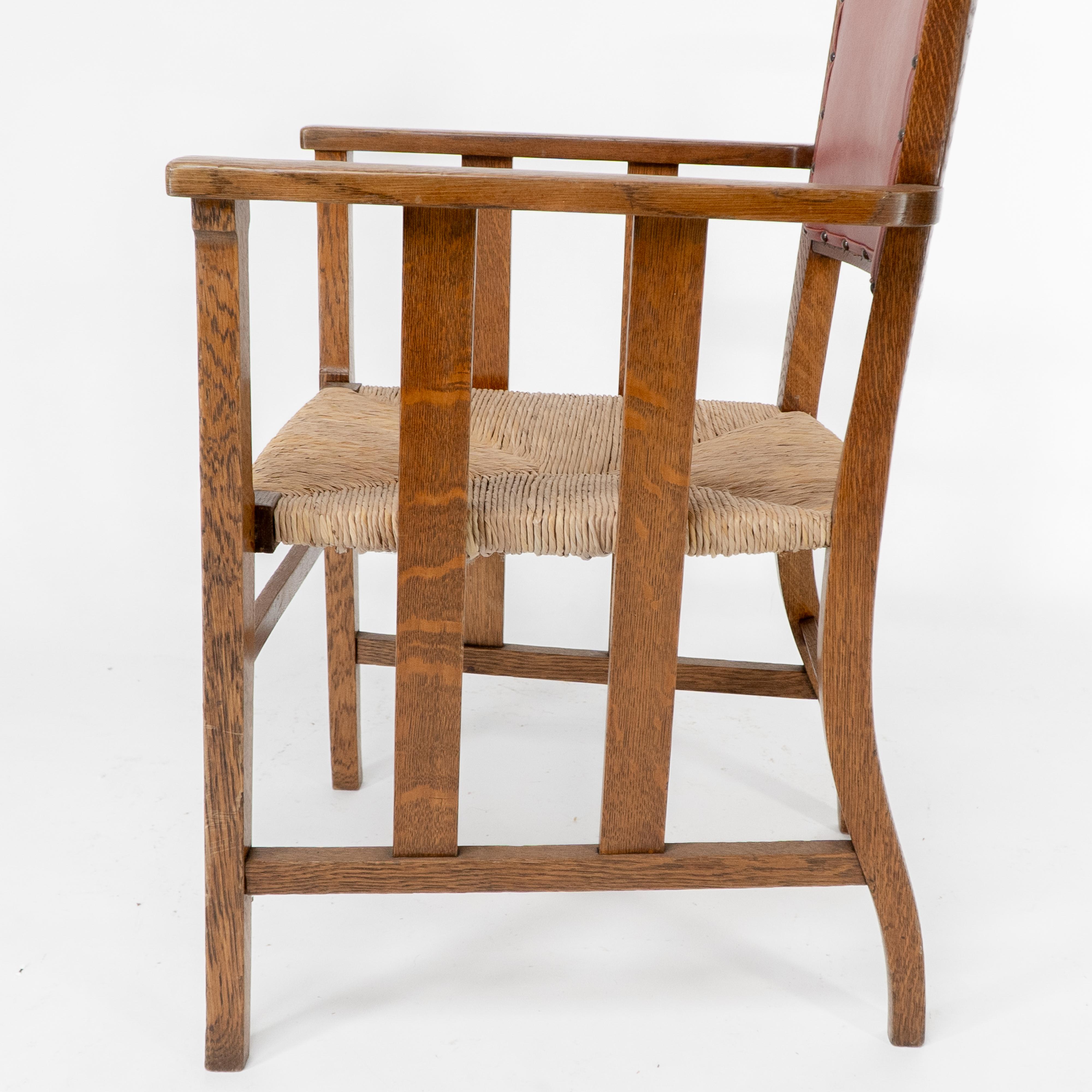 Liberty & Co. An Arts & Crafts rush seat armchair with a shaped back For Sale 8