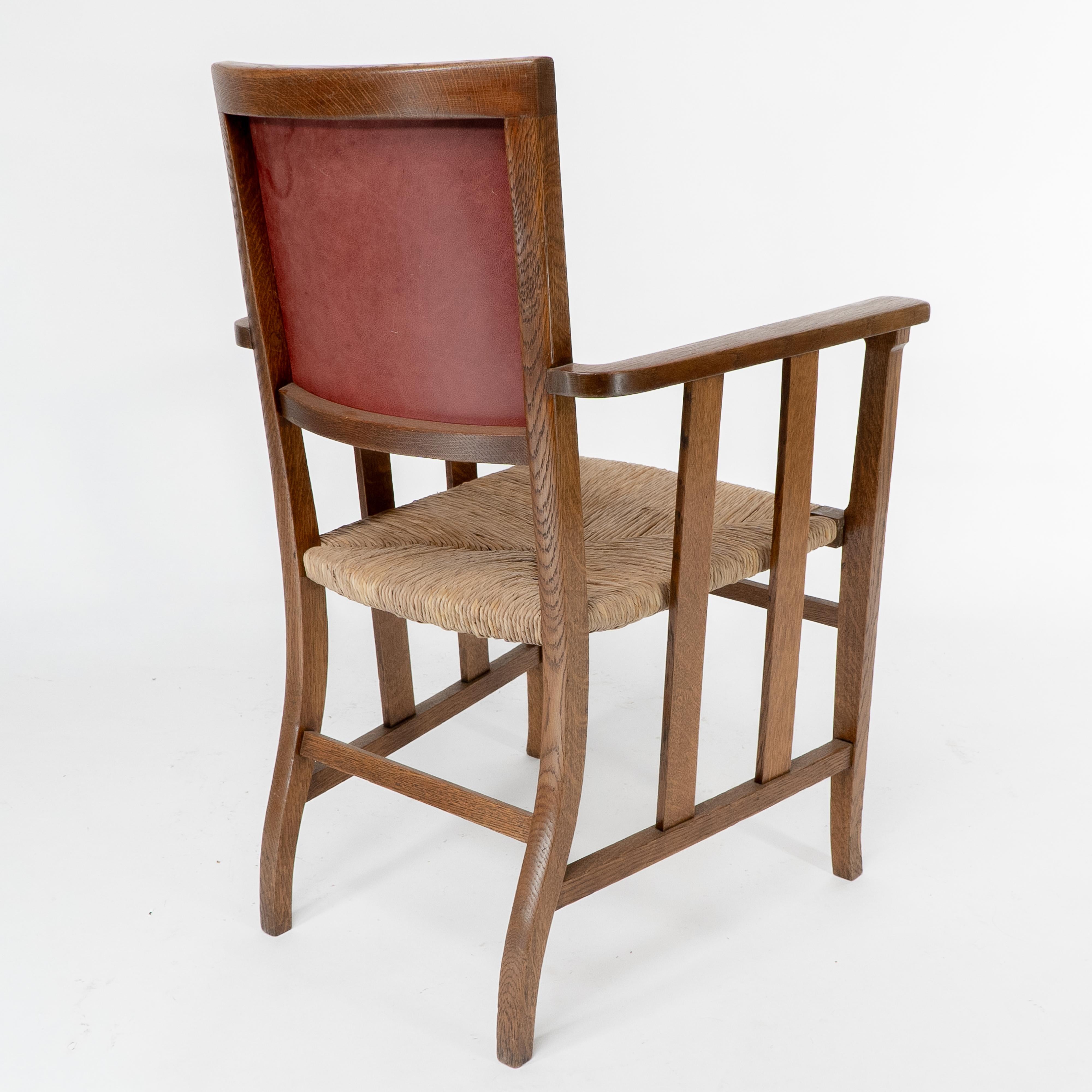 Liberty & Co. An Arts & Crafts rush seat armchair with a shaped back For Sale 11
